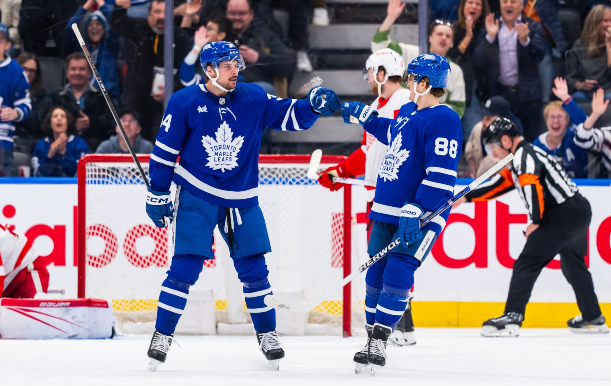 TORONTO, ON - APRIL 13: Auston Matthews #34 of the Toronto Maple Leafs celebrates his goal against the Detroit Red Wings with teammate William Nylander #88 during the second period at Scotiabank Arena on April 13, 2024 in Toronto, Ontario, Canada. (Photo by Thomas Skrlj/NHLI via Getty Images)