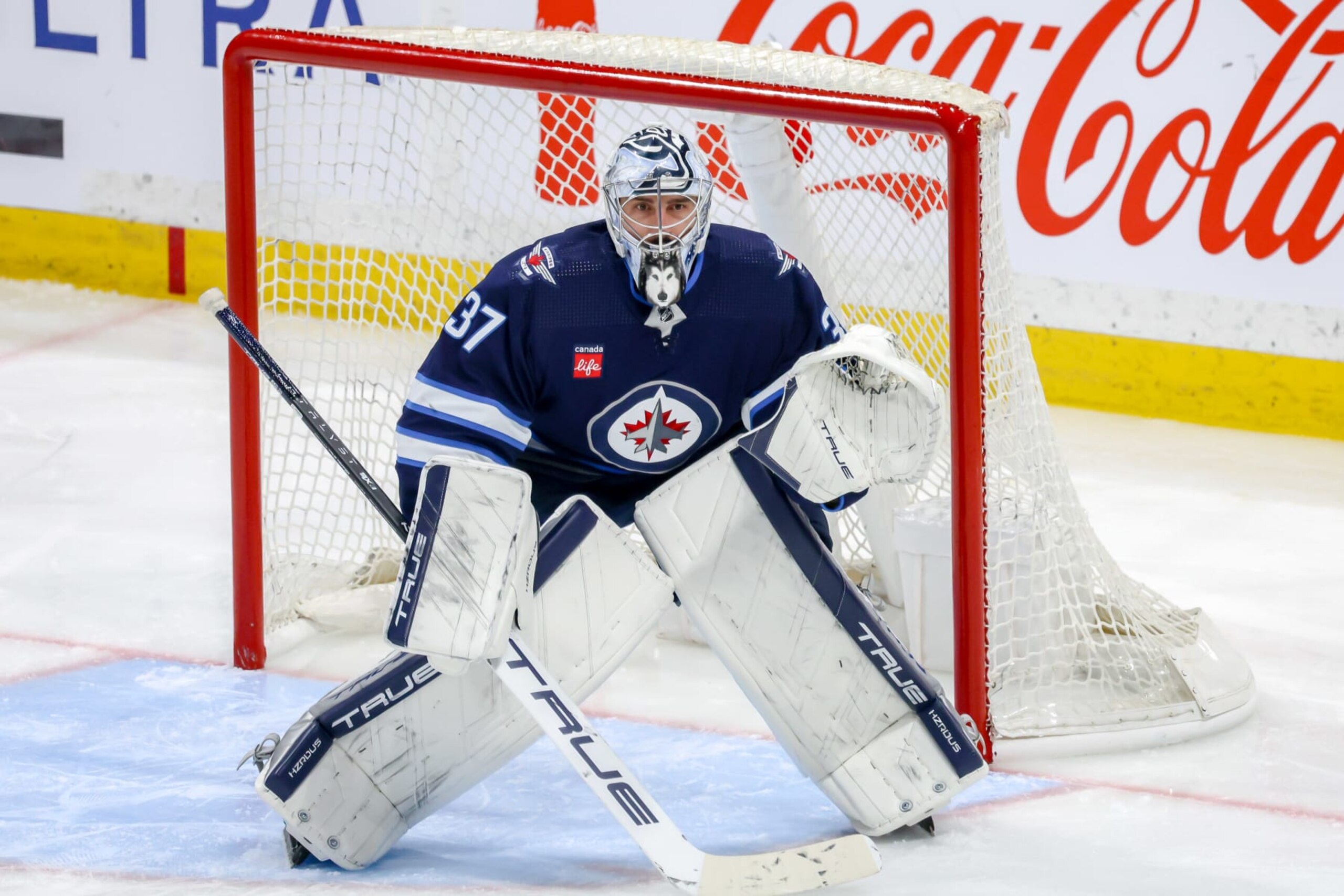 WINNIPEG, CANADA - APRIL 16: Goaltender Connor Hellebuyck #37 of the Winnipeg Jets guards the net during third period action against the Seattle Kraken at the Canada Life Centre on April 16, 2024 in Winnipeg, Manitoba, Canada. (Photo by Jonathan Kozub/NHLI via Getty Images)