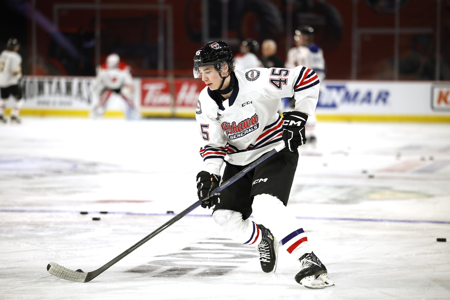 MONCTON, CANADA - JANUARY 23:  Beckett Sennecke #45 of Team White stick handles the puck during practice session of 2024 Kabota Top Prospects game at Avenir Centre on January 23, 2024 in Moncton, Canada. (Photo by Dale Preston/Getty Images)