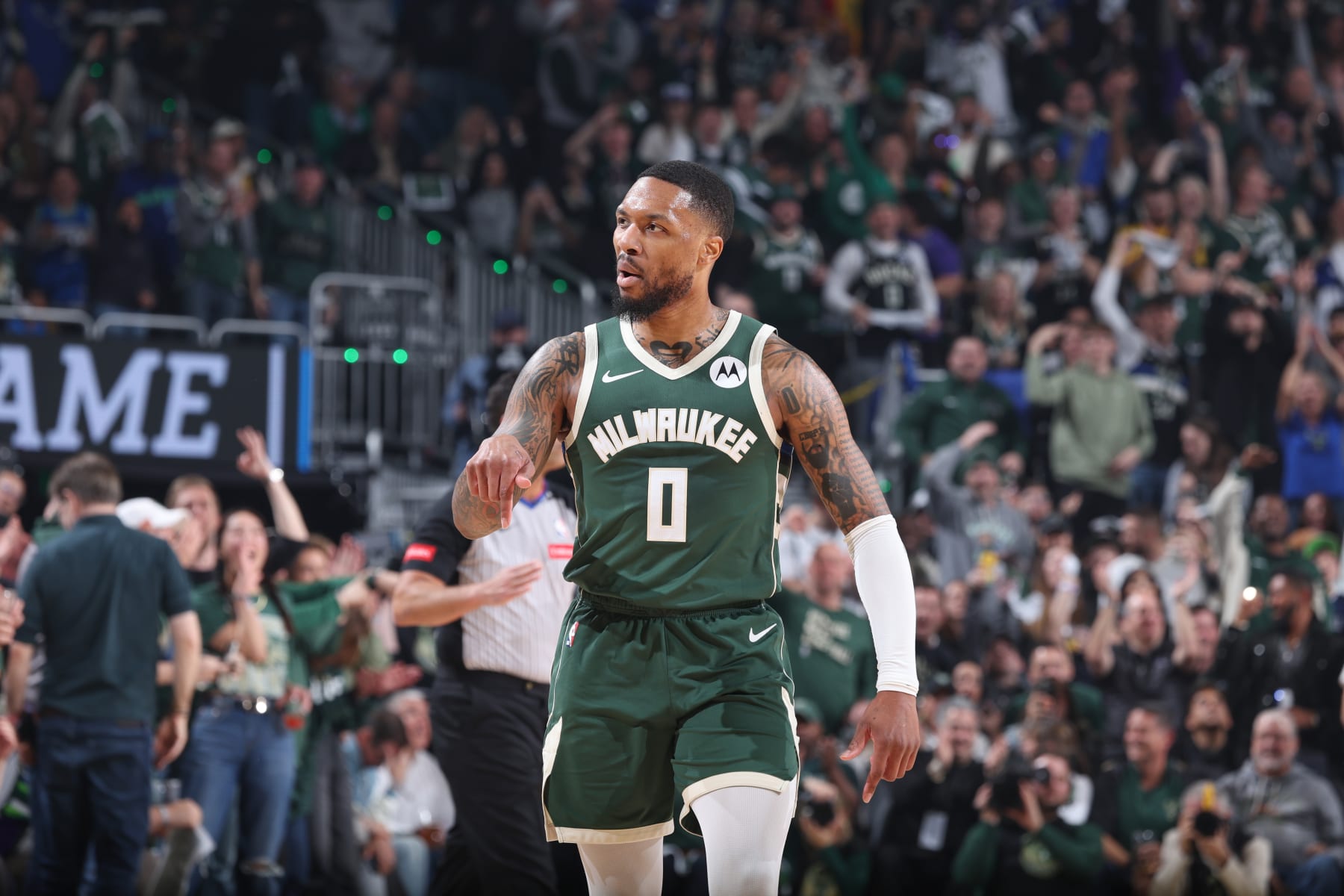 MILWAUKEE, WI - APRIL 21:  Damian Lillard #0 of the Milwaukee Bucks looks on during the game against the Indiana Pacers during Round 1 Game 1 of the 2024 NBA Playoffs  on April 21, 2024 at the Fiserv Forum Center in Milwaukee, Wisconsin. NOTE TO USER: User expressly acknowledges and agrees that, by downloading and or using this Photograph, user is consenting to the terms and conditions of the Getty Images License Agreement. Mandatory Copyright Notice: Copyright 2024 NBAE (Photo by Jeff Haynes/NBAE via Getty Images).