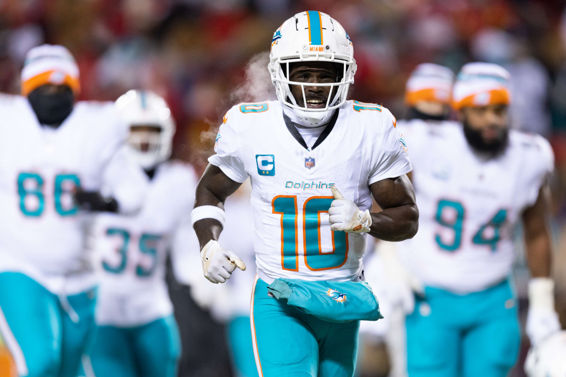 KANSAS CITY, MISSOURI - JANUARY 13: Tyreek Hill #10 of the Miami Dolphins runs toward the locker room at halftime of an NFL wild-card playoff football game against the Kansas City Chiefs at GEHA Field at Arrowhead Stadium on January 13, 2024 in Kansas City, Missouri. (Photo by Kara Durrette/Getty Images)