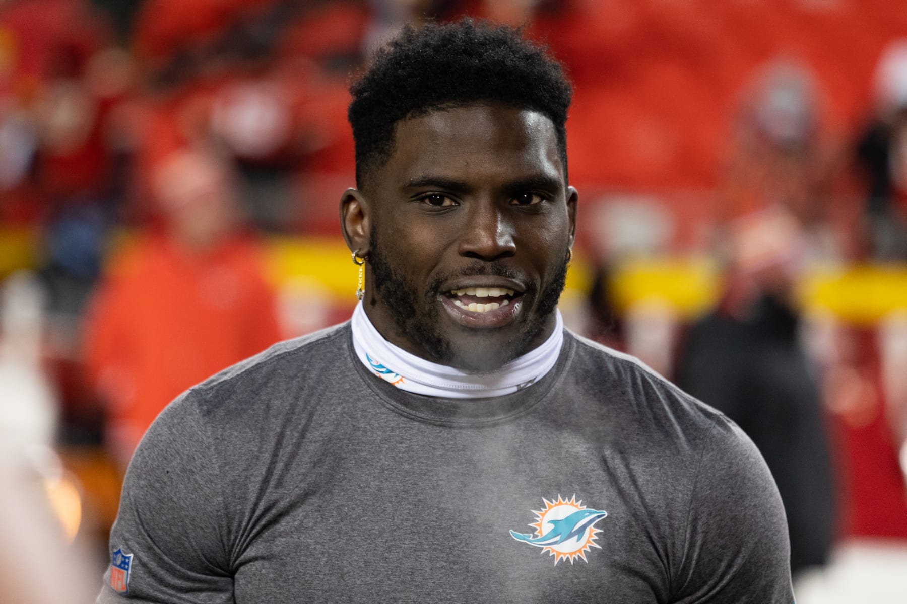 KANSAS CITY, MISSOURI - JANUARY 13: Tyreek Hill #10 of the Miami Dolphins warms up before an NFL wild-card playoff football game at GEHA Field at Arrowhead Stadium on January 13, 2024 in Kansas City, Missouri. (Photo by Kara Durrette/Getty Images)