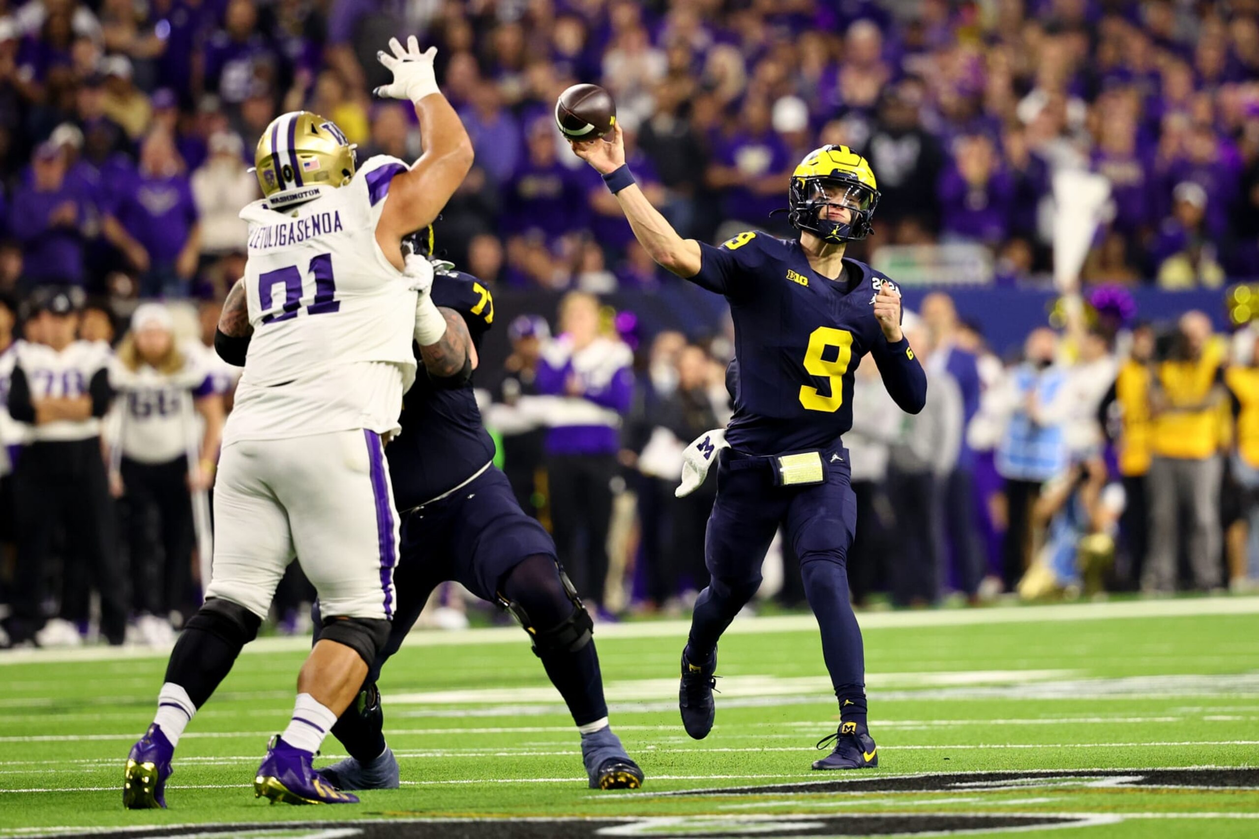 HOUSTON, TEXAS - JANUARY 8: J.J. McCarthy #9 of the Michigan Wolverines passes against the Washington Huskies during the 2024 CFP National Championship game at NRG Stadium on January 8, 2024 in Houston, Texas. (Photo by Jamie Schwaberow/Getty Images) HOUSTON, TEXAS - JANUARY 8: J.J. McCarthy #9 of the Michigan Wolverines passes against the Washington Huskies during the 2024 CFP National Championship game at NRG Stadium on January 8, 2024 in Houston, Texas. (Photo by Jamie Schwaberow/Getty Images)