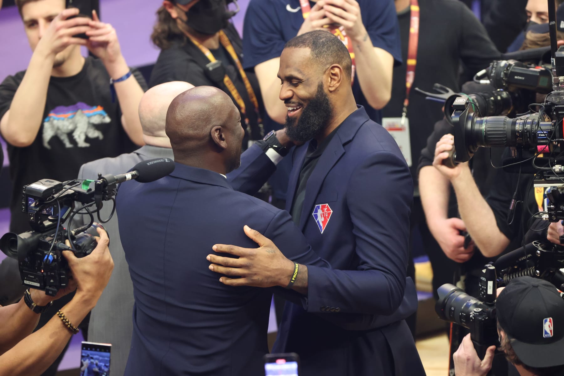 CLEVELAND, OH - FEBRUARY 20: NBA legend Michael Jordan greets LeBron James #6 of the Los Angeles Lakers  during the 2022 NBA All-Star Game as part of 2022 NBA All-Star Weekend on February 20, 2022 at Rocket Mortgage FieldHouse in Cleveland, Ohio. NOTE TO USER: User expressly acknowledges and agrees that, by downloading and or using this photograph, User is consenting to the terms and conditions of the Getty Images License Agreement. Mandatory Copyright Notice: Copyright 2022 NBAE (Photo by Joe Murphy/NBAE via Getty Images)