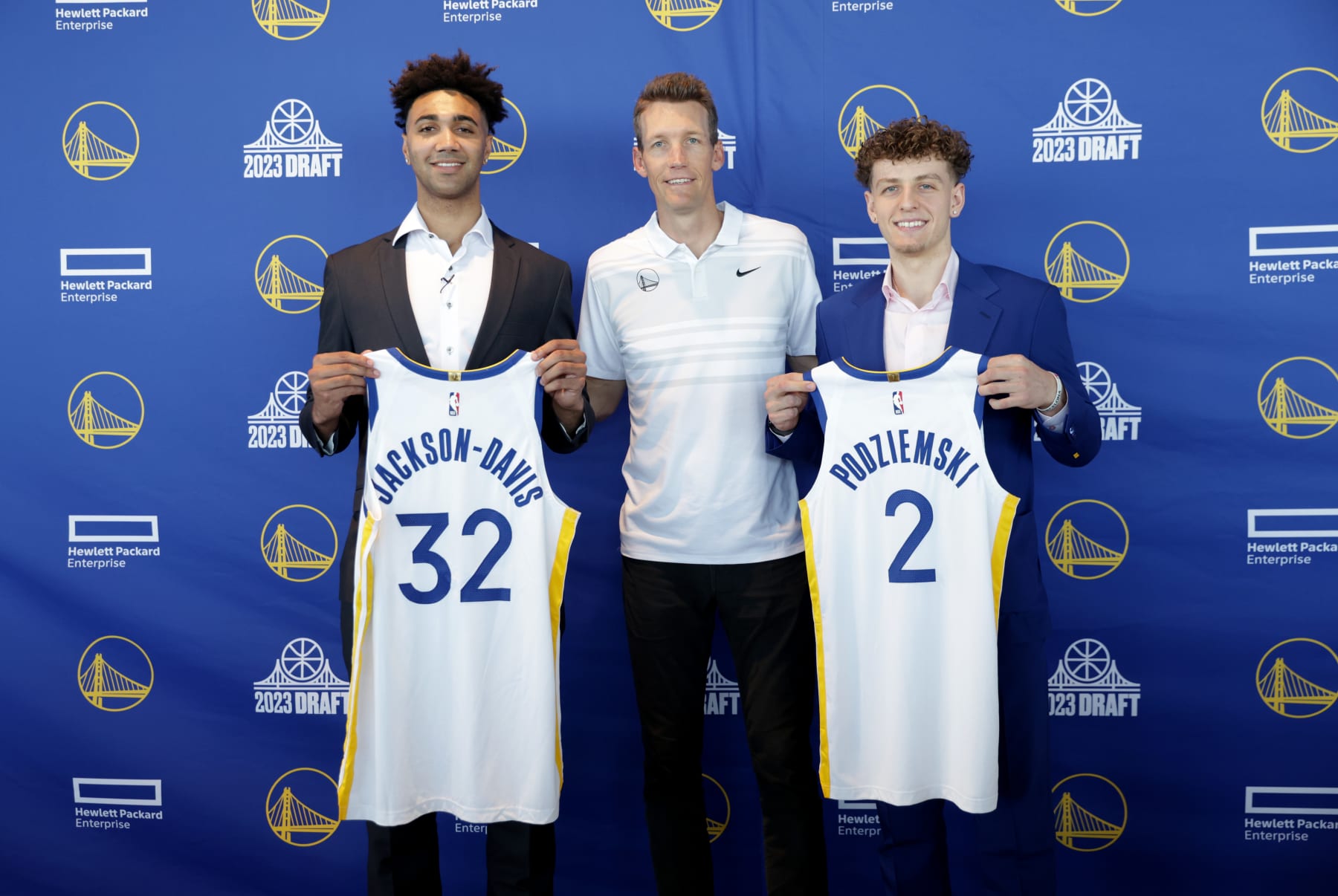 SAN FRANCISCO, CA - JUNE 23: General manager Mike Dunleavy Jr. of the Golden State Warriors, center, poses for pictures with Trayce Jackson-Davis, left and Brandin Podziemski, right, during a press conference on June 23, 2023 at Chase Center in San Francisco, California. NOTE TO USER: User expressly acknowledges and agrees that, by downloading and or using this photograph, user is consenting to the terms and conditions of Getty Images License Agreement. Mandatory Copyright Notice: Copyright 2023 NBAE (Photo by Jed Jacobsohn/NBAE via Getty Images)