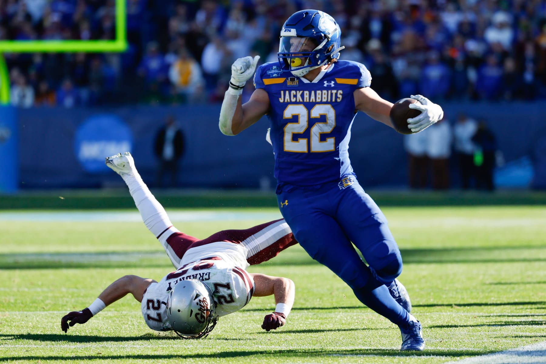 FRISCO, TEXAS - JANUARY 07: Isaiah Davis #22 of the South Dakota State Jackrabbits rushes against the Montana Grizzlies during the Division I FCS Football Championship held at Toyota Stadium on January 7, 2024 in Frisco, Texas. (Photo by C. Morgan Engel/NCAA Photos via Getty Images)