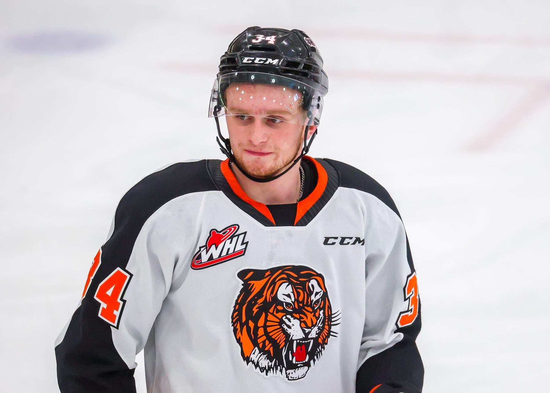 WINNIPEG, CANADA - APRIL 01: Andrew Basha #34 of the Medicine Hat Tigers looks on during a second period stoppage of play against the Winnipeg ICE in Game Two of the First Round of the 2023 WHL Playoffs at Wayne Fleming Arena on April 01, 2023 in Winnipeg, Manitoba, Canada. (Photo by Jonathan Kozub/Getty Images)