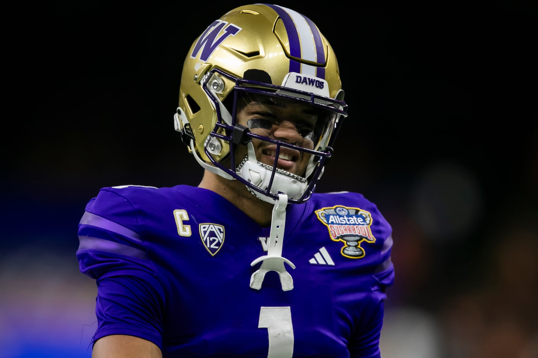 NEW ORLEANS, LA - JANUARY 01: Washington wide receiver Rome Odunze (1) prepares to warmup prior to the All State Sugar Bowl playoff game between the Texas Longhorns and the Washington Huskies on Monday, January 1, 2024 at Caesars Superdome in New Orleans, LA.  (Photo by Nick Tre. Smith/Icon Sportswire via Getty Images)