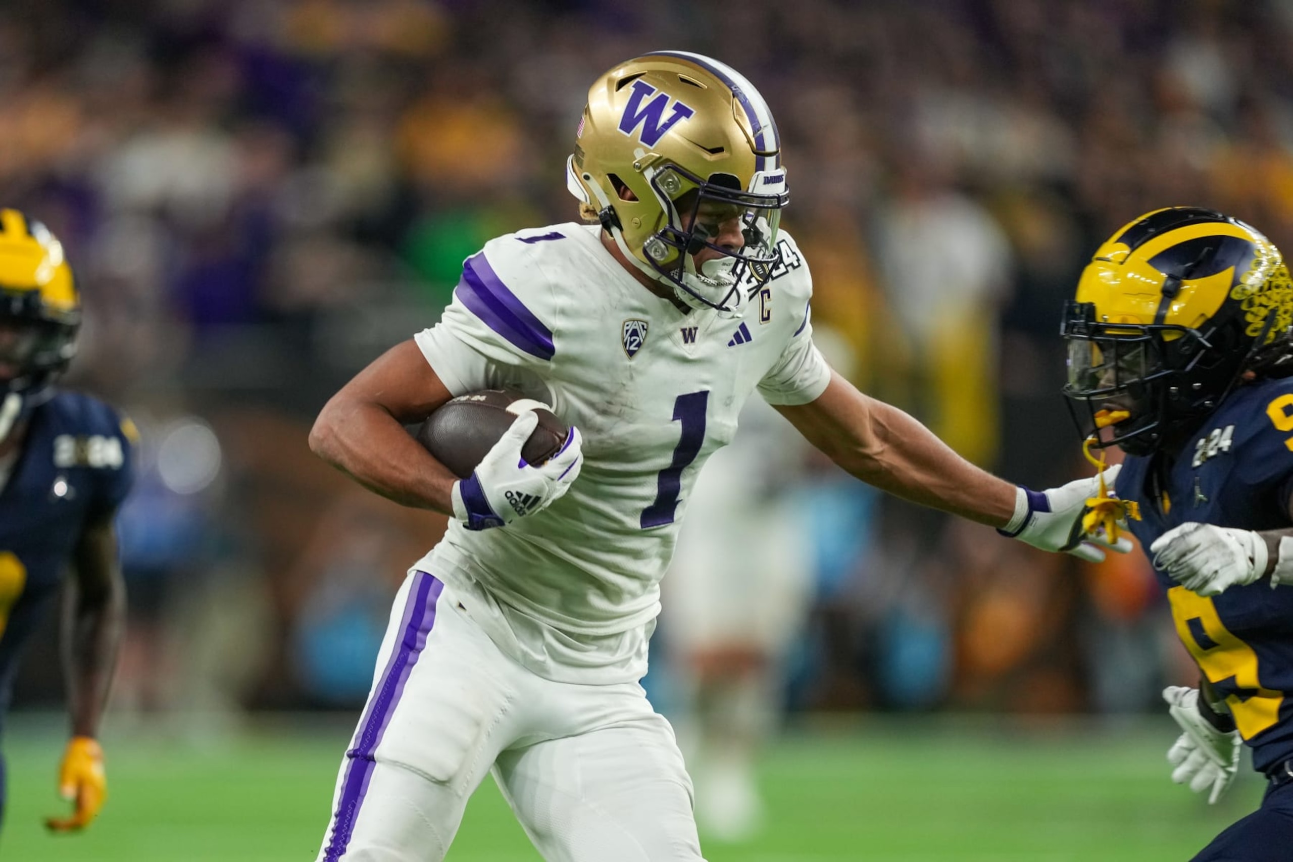 HOUSTON, TX - JANUARY 08: Washington Huskies wide receiver Rome Odunze (1) runs the ball during the CFP National Championship game between the Michigan Wolverines and Washington Huskies on January 8, 2024 at NRG Stadium in Houston, Texas. (Photo by Daniel Dunn/Icon Sportswire via Getty Images) HOUSTON, TX - JANUARY 08: Washington Huskies wide receiver Rome Odunze (1) runs the ball during the CFP National Championship game between the Michigan Wolverines and Washington Huskies on January 8, 2024 at NRG Stadium in Houston, Texas. (Photo by Daniel Dunn/Icon Sportswire via Getty Images)