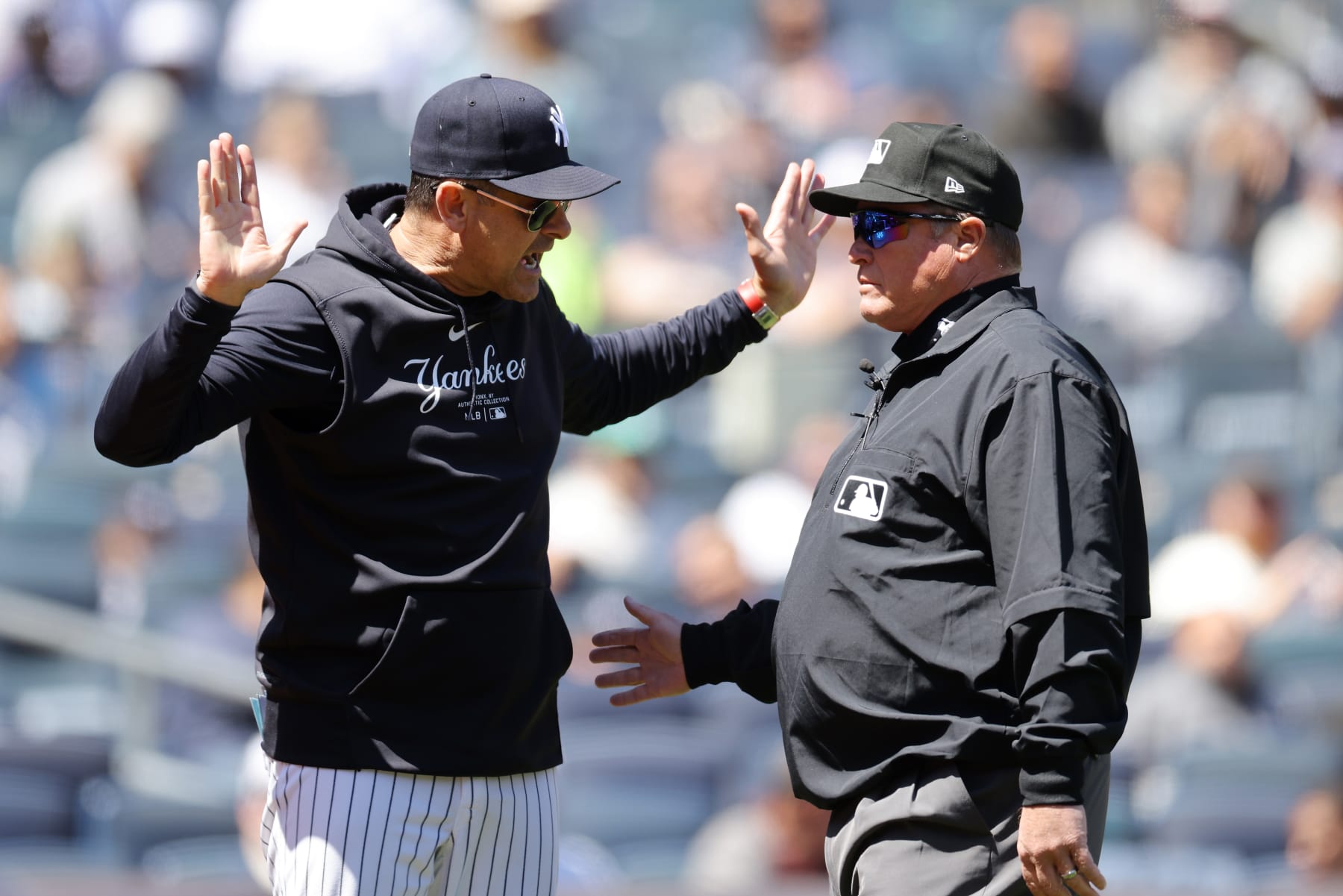 NEW YORK, NEW YORK - APRIL 22: Aaron Boone #17 of the New York Yankees argues with third base umpire Marvin Hudson #51 in the first inning during the game against the Oakland Athletics at Yankee Stadium on April 22, 2024 in New York City. (Photo by Mike Stobe/Getty Images)