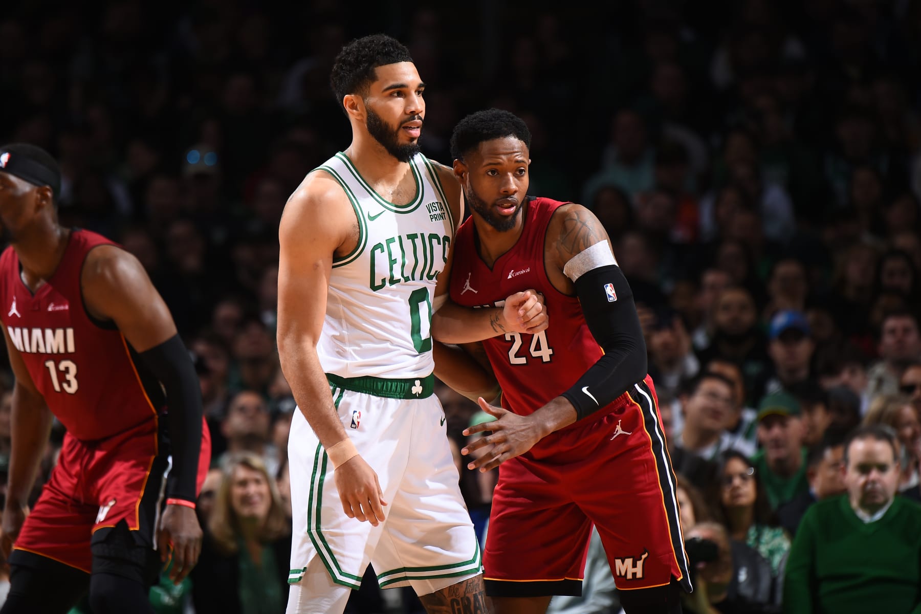BOSTON, MA - APRIL 21: Jayson Tatum #0 of the Boston Celtics and Haywood Highsmith #24 of the Miami Heat look on during the game during Round 1 Game 1 of the 2024 NBA Playoffs on April 21, 2024 at the TD Garden in Boston, Massachusetts. NOTE TO USER: User expressly acknowledges and agrees that, by downloading and or using this photograph, User is consenting to the terms and conditions of the Getty Images License Agreement. Mandatory Copyright Notice: Copyright 2024 NBAE (Photo by Brian Babineau/NBAE via Getty Images) BOSTON, MA - APRIL 21: Jayson Tatum #0 of the Boston Celtics and Haywood Highsmith #24 of the Miami Heat look on during the game during Round 1 Game 1 of the 2024 NBA Playoffs on April 21, 2024 at the TD Garden in Boston, Massachusetts. NOTE TO USER: User expressly acknowledges and agrees that, by downloading and or using this photograph, User is consenting to the terms and conditions of the Getty Images License Agreement. Mandatory Copyright Notice: Copyright 2024 NBAE (Photo by Brian Babineau/NBAE via Getty Images)