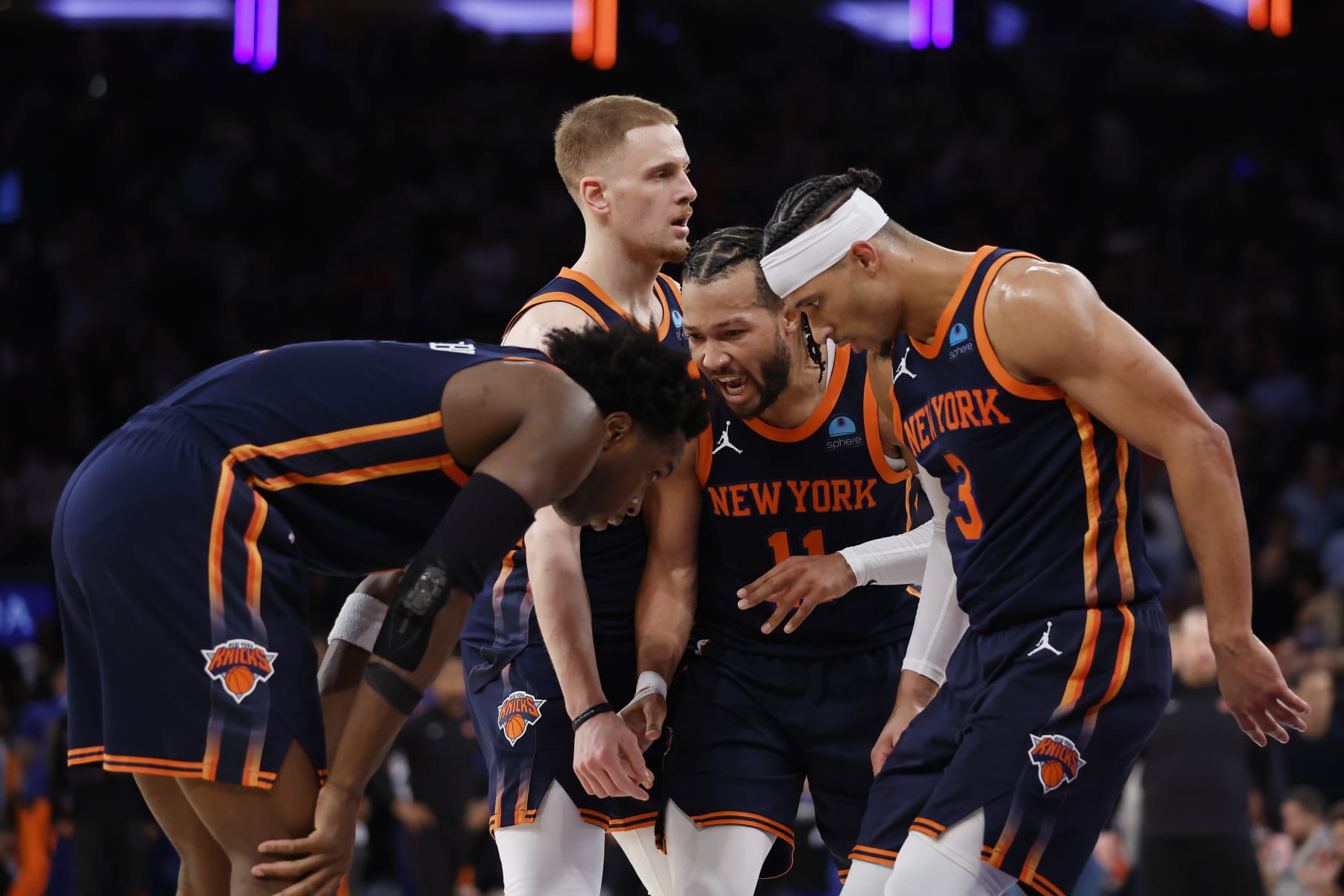 NEW YORK, NEW YORK - APRIL 22: Jalen Brunson #11 of the New York Knicks huddles with Josh Hart #3, Donte DiVincenzo #0, and OG Anunoby #8 of the New York Knicks during the second half against the Philadelphia 76ers in Game Two of the Eastern Conference First Round Playoffs at Madison Square Garden on April 22, 2024 in New York City. The Knicks won 104-101. NOTE TO USER: User expressly acknowledges and agrees that, by downloading and or using this photograph, User is consenting to the terms and conditions of the Getty Images License Agreement. (Photo by Sarah Stier/Getty Images)