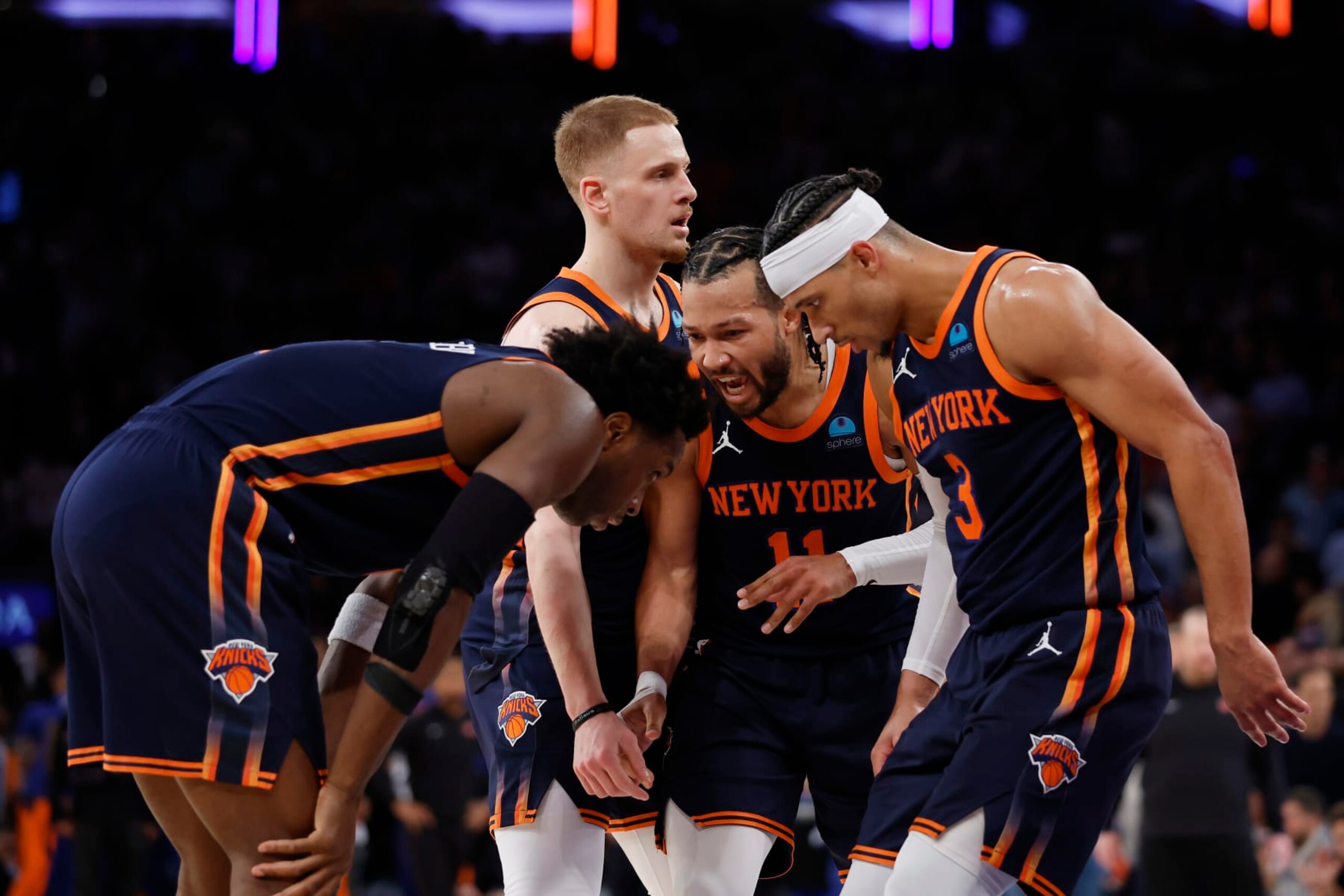 NEW YORK, NEW YORK - APRIL 22: Jalen Brunson #11 of the New York Knicks huddles with Josh Hart #3, Donte DiVincenzo #0, and OG Anunoby #8 of the New York Knicks during the second half against the Philadelphia 76ers in Game Two of the Eastern Conference First Round Playoffs at Madison Square Garden on April 22, 2024 in New York City. The Knicks won 104-101. NOTE TO USER: User expressly acknowledges and agrees that, by downloading and or using this photograph, User is consenting to the terms and conditions of the Getty Images License Agreement. (Photo by Sarah Stier/Getty Images) NEW YORK, NEW YORK - APRIL 22: Jalen Brunson #11 of the New York Knicks huddles with Josh Hart #3, Donte DiVincenzo #0, and OG Anunoby #8 of the New York Knicks during the second half against the Philadelphia 76ers in Game Two of the Eastern Conference First Round Playoffs at Madison Square Garden on April 22, 2024 in New York City. The Knicks won 104-101. NOTE TO USER: User expressly acknowledges and agrees that, by downloading and or using this photograph, User is consenting to the terms and conditions of the Getty Images License Agreement. (Photo by Sarah Stier/Getty Images)