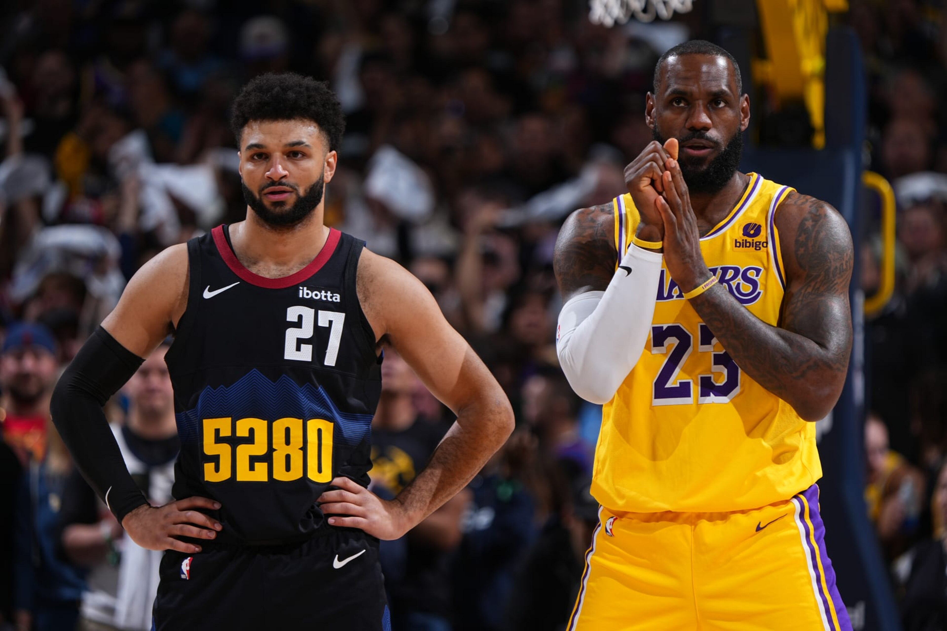 DENVER, CO - APRRIL 22: Jamal Murray #27 of the Denver Nuggets and LeBron James #23 of the Los Angeles Lakers look on during the game during Round 1 Game 2 of the 2024 NBA Playoffs on April 22, 2024 at the Ball Arena in Denver, Colorado. NOTE TO USER: User expressly acknowledges and agrees that, by downloading and/or using this Photograph, user is consenting to the terms and conditions of the Getty Images License Agreement. Mandatory Copyright Notice: Copyright 2024 NBAE (Photo by Garrett Ellwood/NBAE via Getty Images) DENVER, CO - APRRIL 22: Jamal Murray #27 of the Denver Nuggets and LeBron James #23 of the Los Angeles Lakers look on during the game during Round 1 Game 2 of the 2024 NBA Playoffs on April 22, 2024 at the Ball Arena in Denver, Colorado. NOTE TO USER: User expressly acknowledges and agrees that, by downloading and/or using this Photograph, user is consenting to the terms and conditions of the Getty Images License Agreement. Mandatory Copyright Notice: Copyright 2024 NBAE (Photo by Garrett Ellwood/NBAE via Getty Images)