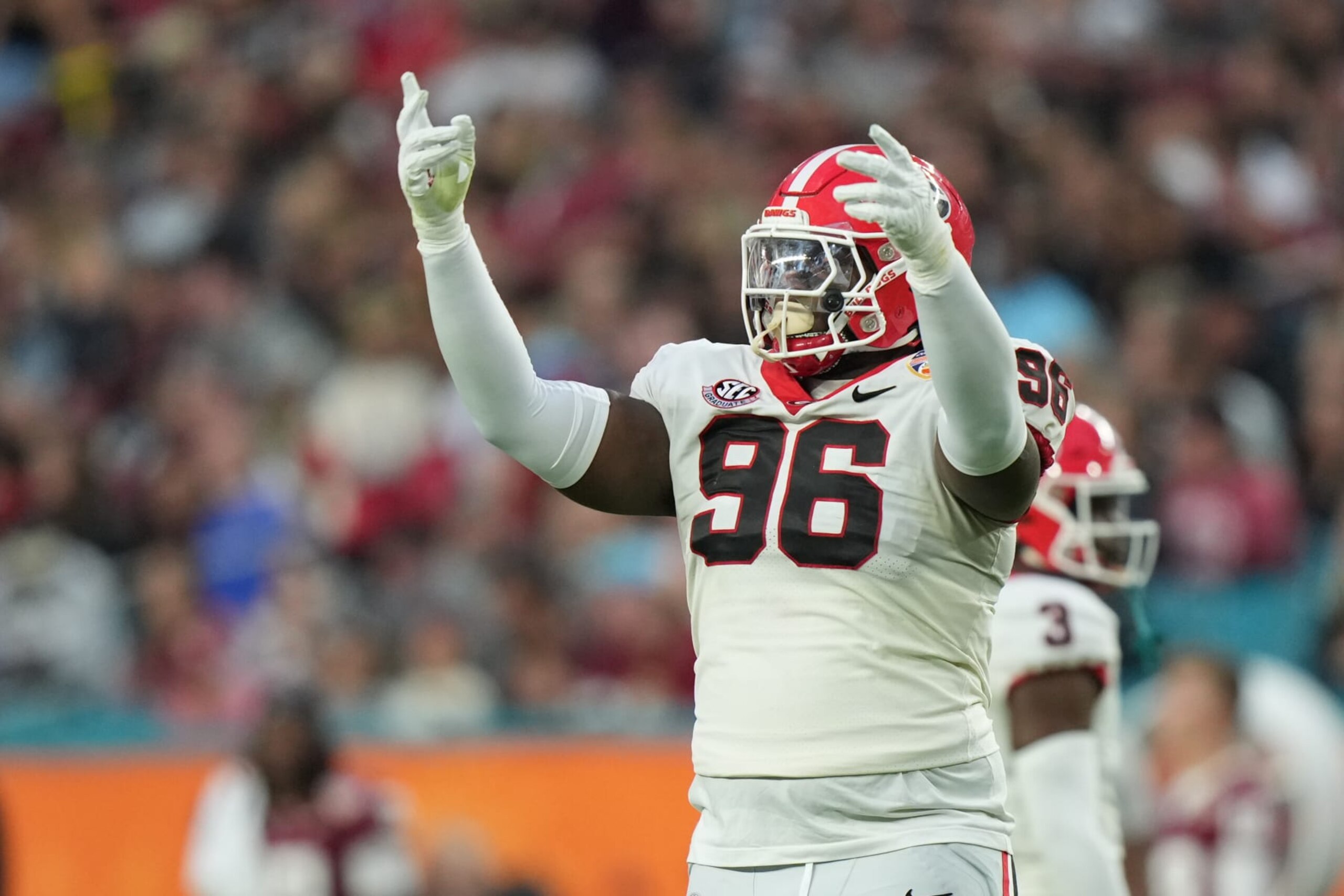 MIAMI GARDENS, FL - DECEMBER 30: Georgia Bulldogs defensive lineman Zion Logue (96) tires to excite the Georgia fans during the Capital One Orange Bowl game between the Georgia Bulldogs and the Florida State Seminoles on Saturday, December 30, 2023 at Hard Rock Stadium, Miami Gardens, Fla. (Photo by Peter Joneleit/Icon Sportswire via Getty Images)