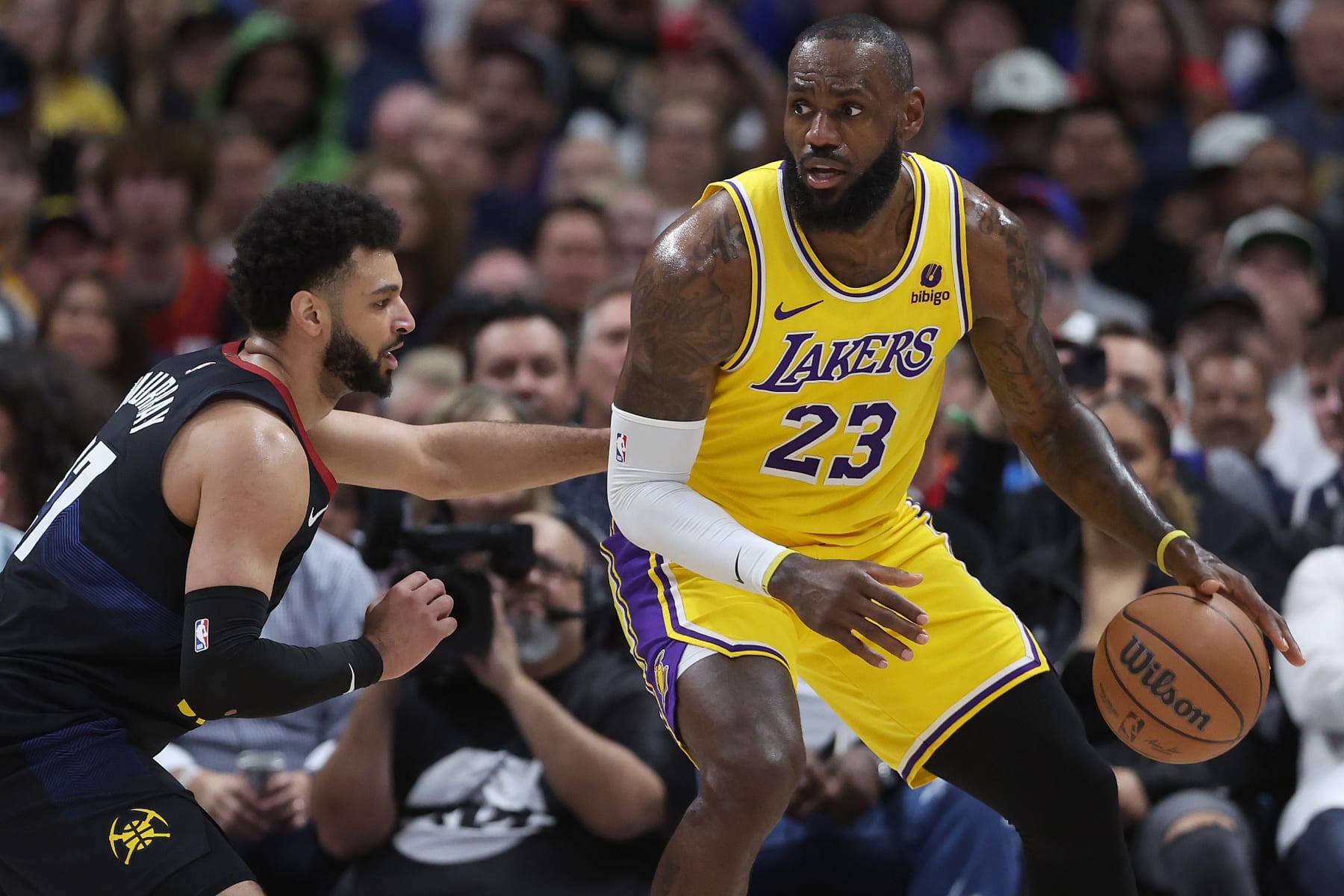 DENVER, COLORADO - APRIL 22: Jamal Murray #27 of the Denver Nuggets guards LeBron James #23 of the Los Angeles Lakers in the second quarter during game two of the Western Conference First Round Playoffs at Ball Arena on April 22, 2024 in Denver, Colorado. NOTE TO USER: User expressly acknowledges and agrees that, by downloading and or using this photograph, User is consenting to the terms and conditions of the Getty Images License Agreement. (Photo by Matthew Stockman/Getty Images)