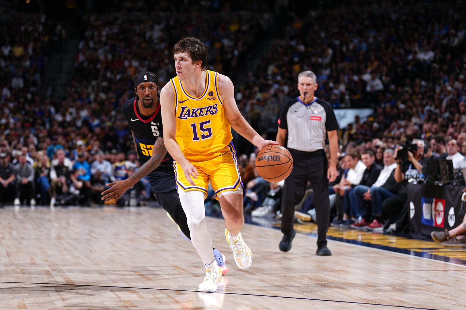 DENVER, CO - APRRIL 22: Austin Reaves #15 of the Los Angeles Lakers drives to the basket during the game against the Denver Nuggets during Round 1 Game 2 of the 2024 NBA Playoffs on April 22, 2024 at the Ball Arena in Denver, Colorado. NOTE TO USER: User expressly acknowledges and agrees that, by downloading and/or using this Photograph, user is consenting to the terms and conditions of the Getty Images License Agreement. Mandatory Copyright Notice: Copyright 2024 NBAE (Photo by Garrett Ellwood/NBAE via Getty Images)