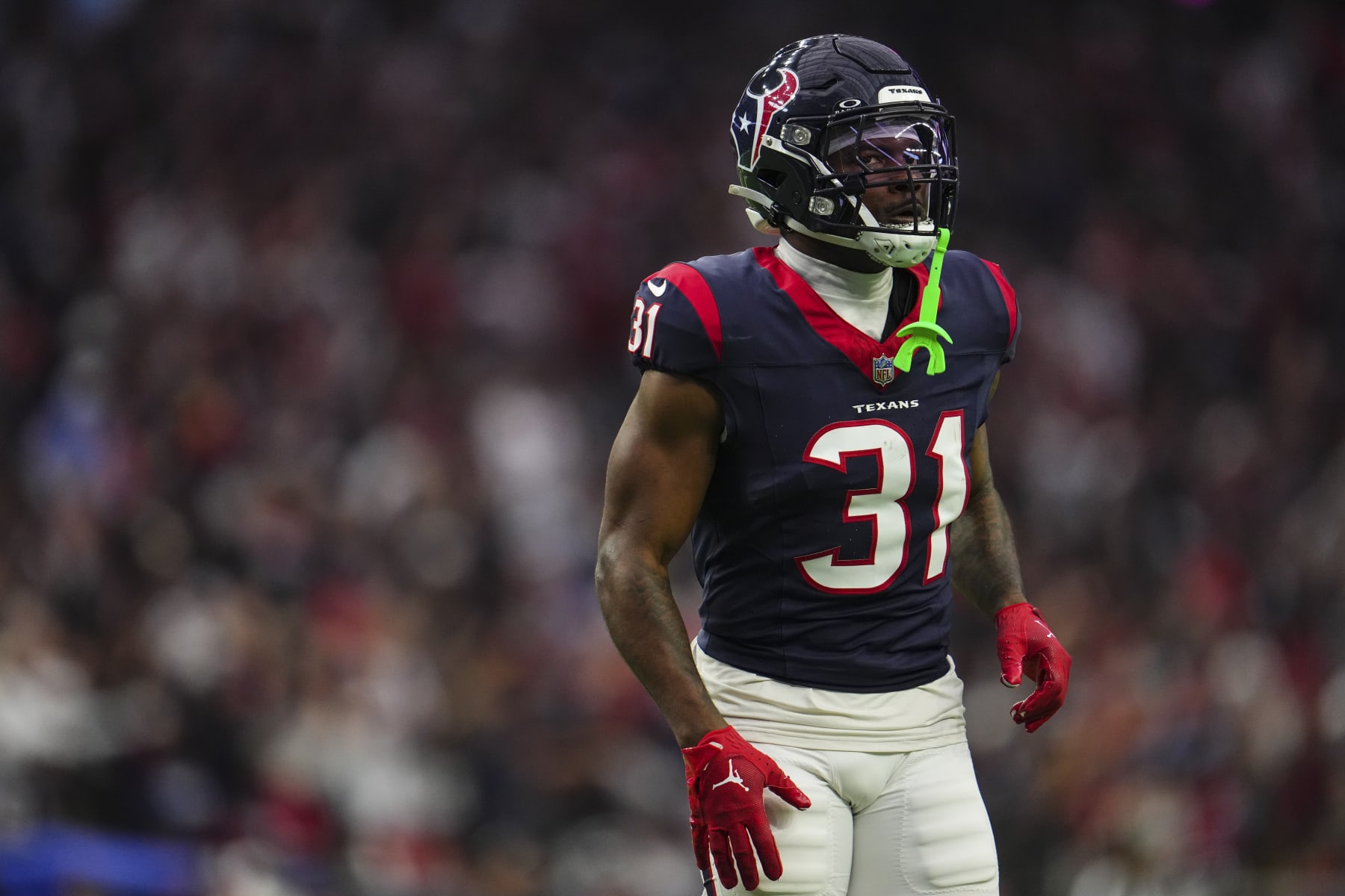 HOUSTON, TX - JANUARY 13: Dameon Pierce #31 of the Houston Texans looks on from the field during an NFL wild-card playoff football game against the Cleveland Browns at NRG Stadium on January 13, 2024 in Houston, Texas. (Photo by Cooper Neill/Getty Images)