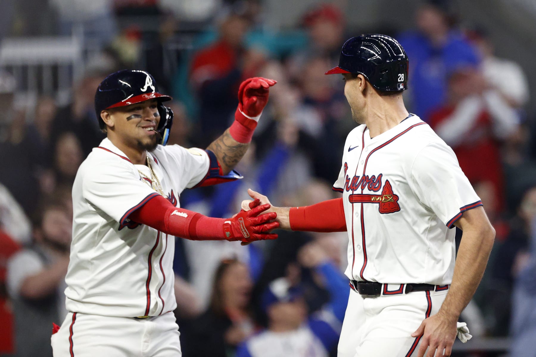 ATLANTA, GA - APRIL 06: Atlanta Braves first baseman Matt Olson #28 is congratulated by Atlanta Braves shortstop Orlando Arcia #11 after scoring a run during the MLB game between the Arizona Diamondbacks and the Atlanta Braves on April 6, 2024 at TRUIST Park in Atlanta, GA. (Photo by Jeff Robinson/Icon Sportswire via Getty Images)