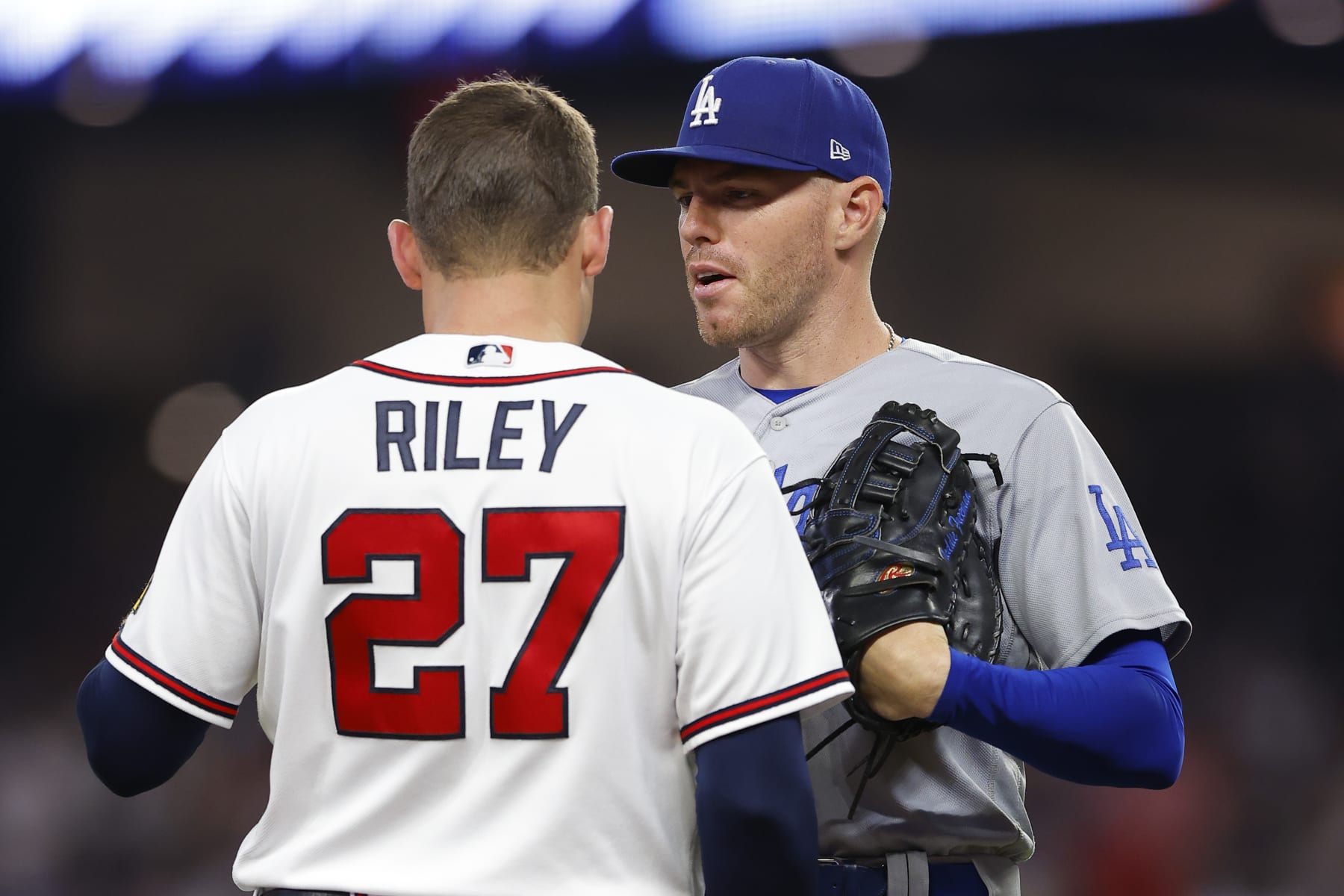 ATLANTA, GA - MAY 24: Freddie Freeman #5 of the Los Angeles Dodgers speaks with Austin Riley #27 of the Atlanta Braves during the sixth inning at Truist Park on May 24, 2023 in Atlanta, Georgia. (Photo by Todd Kirkland/Getty Images)
