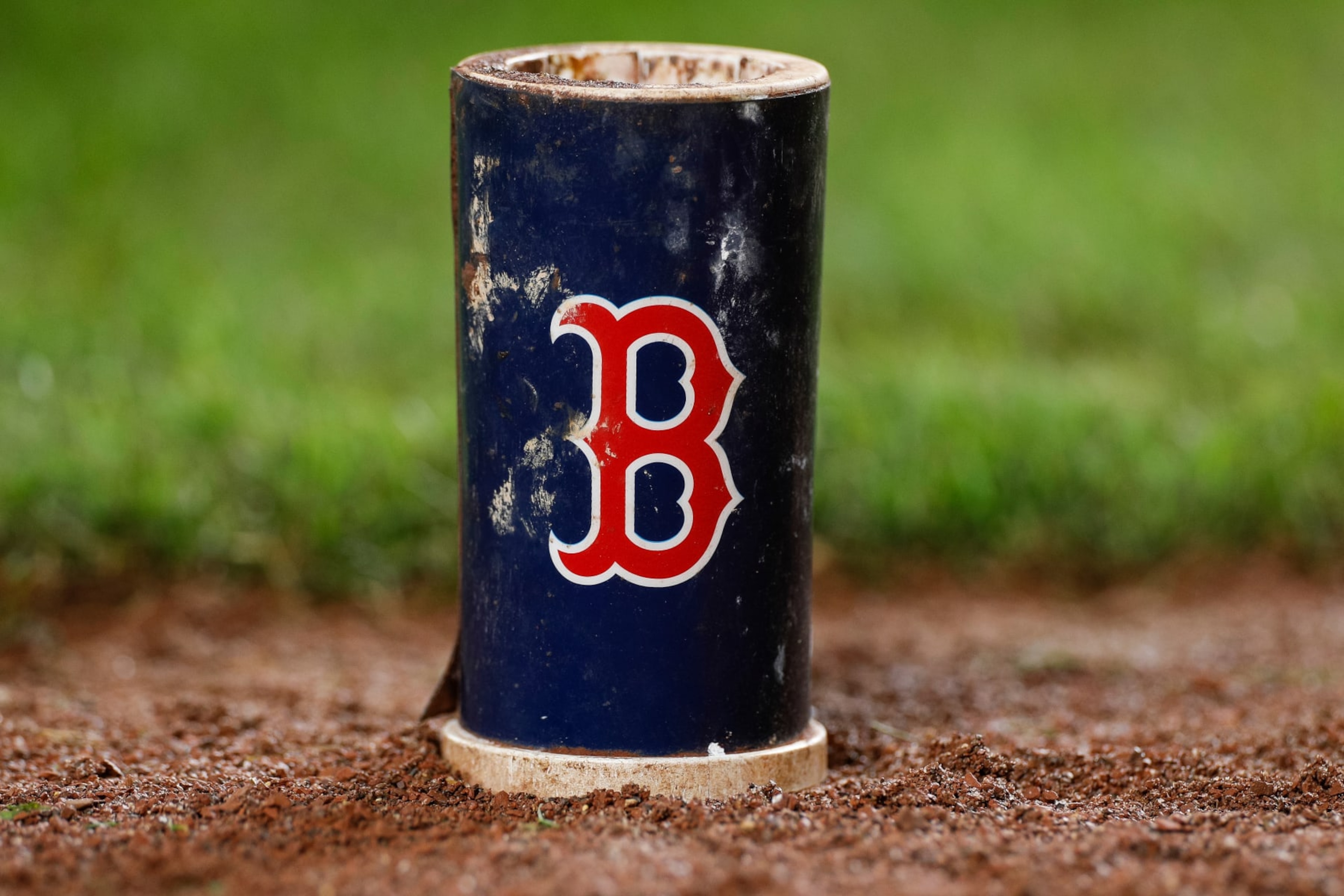 BALTIMORE, MARYLAND - SEPTEMBER 28: Detail view of a baseball bat weight with a Boston Red Sox logo during a game against the Baltimore Orioles at Oriole Park at Camden Yards on September 28, 2023 in Baltimore, Maryland. (Photo by Brandon Sloter/Image Of Sport/Getty Images)