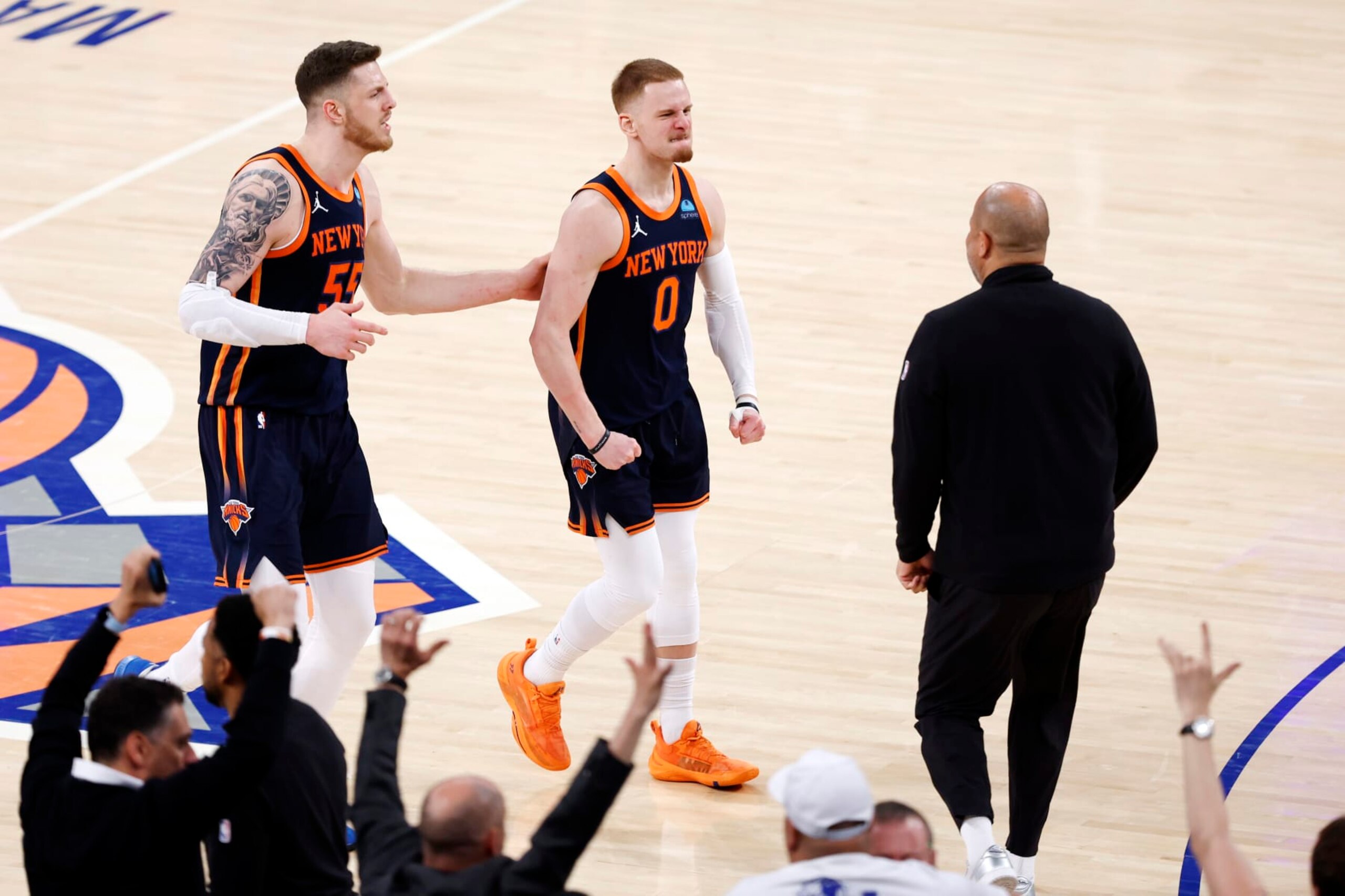 NEW YORK, NEW YORK - APRIL 22: Donte DiVincenzo #0 reacts with Isaiah Hartenstein #55 of the New York Knicks after making a go-ahead three-point shot during the second half of the game against the Philadelphia 76ers in Game Two of the Eastern Conference First Round Playoffs at Madison Square Garden on April 22, 2024 in New York City. The Knicks won 104-101. NOTE TO USER: User expressly acknowledges and agrees that, by downloading and or using this photograph, User is consenting to the terms and conditions of the Getty Images License Agreement. (Photo by Sarah Stier/Getty Images) NEW YORK, NEW YORK - APRIL 22: Donte DiVincenzo #0 reacts with Isaiah Hartenstein #55 of the New York Knicks after making a go-ahead three-point shot during the second half of the game against the Philadelphia 76ers in Game Two of the Eastern Conference First Round Playoffs at Madison Square Garden on April 22, 2024 in New York City. The Knicks won 104-101. NOTE TO USER: User expressly acknowledges and agrees that, by downloading and or using this photograph, User is consenting to the terms and conditions of the Getty Images License Agreement. (Photo by Sarah Stier/Getty Images)