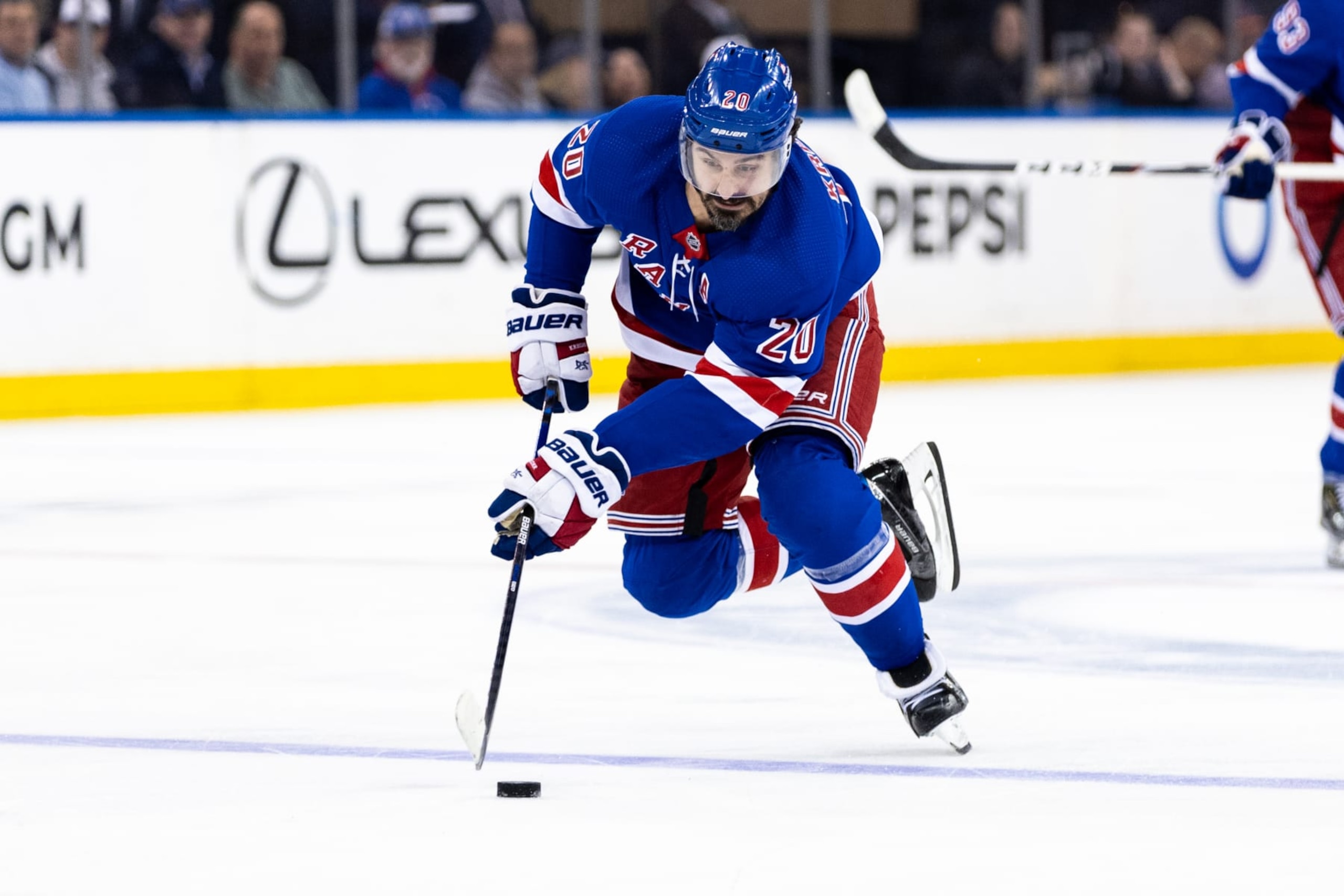 NEW YORK, NEW YORK - APRIL 11: Chris Kreider #20 of the New York Rangers carries the puck during the second period of the game against the Philadelphia Flyers at Madison Square Garden on April 11, 2024 in New York City. (Photo by Dustin Satloff/Getty Images) NEW YORK, NEW YORK - APRIL 11: Chris Kreider #20 of the New York Rangers carries the puck during the second period of the game against the Philadelphia Flyers at Madison Square Garden on April 11, 2024 in New York City. (Photo by Dustin Satloff/Getty Images)