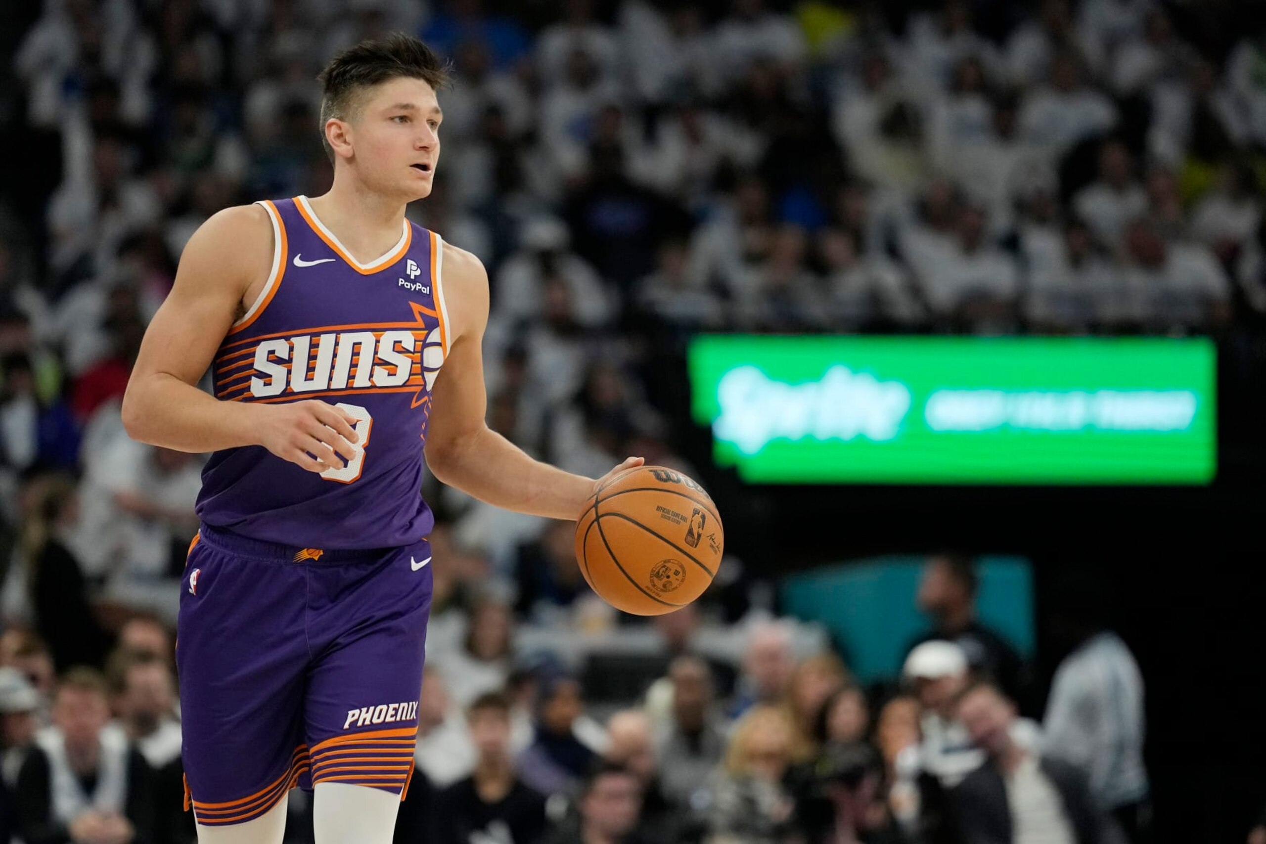 MINNEAPOLIS, MINNESOTA - APRIL 20: Grayson Allen #8 of the Phoenix Suns dribbles the ball during the second half in game one of the Western Conference First Round Playoffs against the Minnesota Timberwolves at Target Center on April 20, 2024 in Minneapolis, Minnesota. NOTE TO USER: User expressly acknowledges and agrees that, by downloading and or using this photograph, User is consenting to the terms and conditions of the Getty Images License Agreement. (Photo by Patrick McDermott/Getty Images)