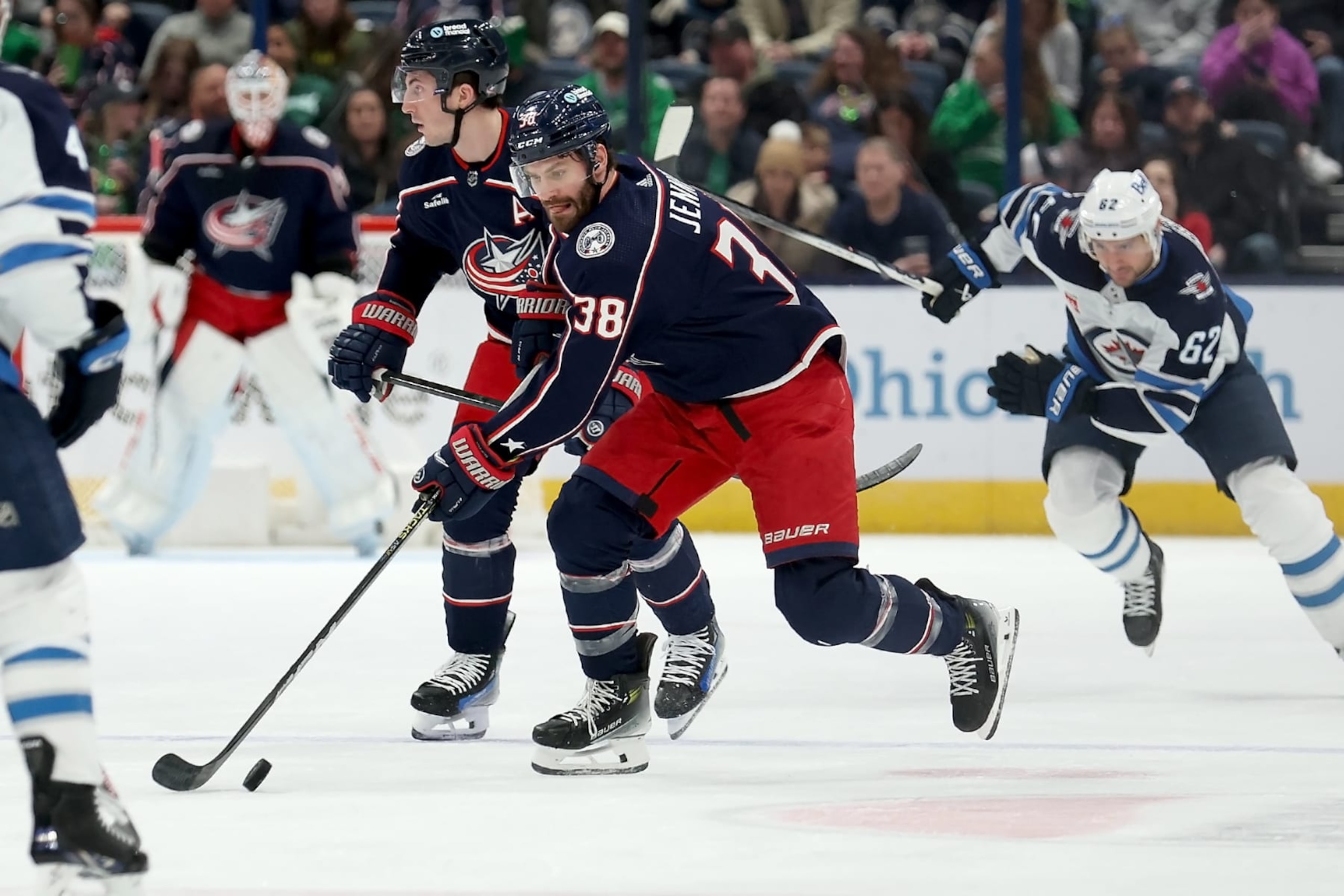 COLUMBUS, OHIO - MARCH 17:  Boone Jenner #38 of the Columbus Blue Jackets controls the puck during the game against the Winnipeg Jets at Nationwide Arena on March 17, 2024 in Columbus, Ohio. (Photo by Kirk Irwin/Getty Images)