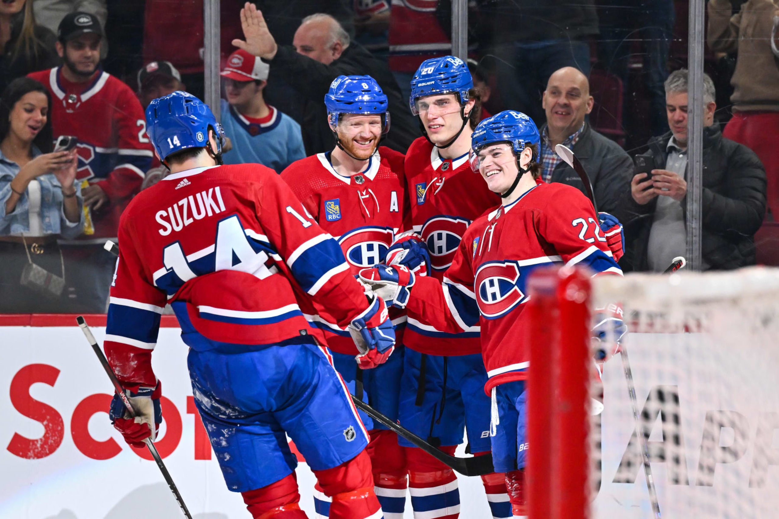 MONTREAL, CANADA - APRIL 16:  Cole Caufield #22 of the Montreal Canadiens celebrates his goal with teammates Mike Matheson #8, Juraj Slafkovsky #20 and Nick Suzuki #14 during the second period against the Detroit Red Wings at the Bell Centre on April 16, 2024 in Montreal, Quebec, Canada.  (Photo by Minas Panagiotakis/Getty Images)
