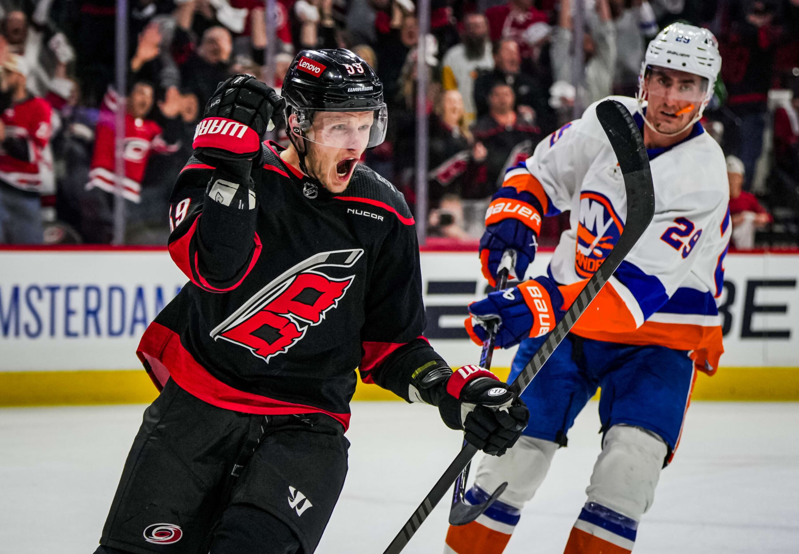 RALEIGH, NORTH CAROLINA - APRIL 22:  Jake Guentzel #59 of the Carolina Hurricanes celebrates after a goal during the third period against the New York Islanders in Game Two of the First Round of the 2024 Stanley Cup Playoffs at PNC Arena on April 22, 2024 in Raleigh, North Carolina. (Photo by Josh Lavallee/NHLI via Getty Images)