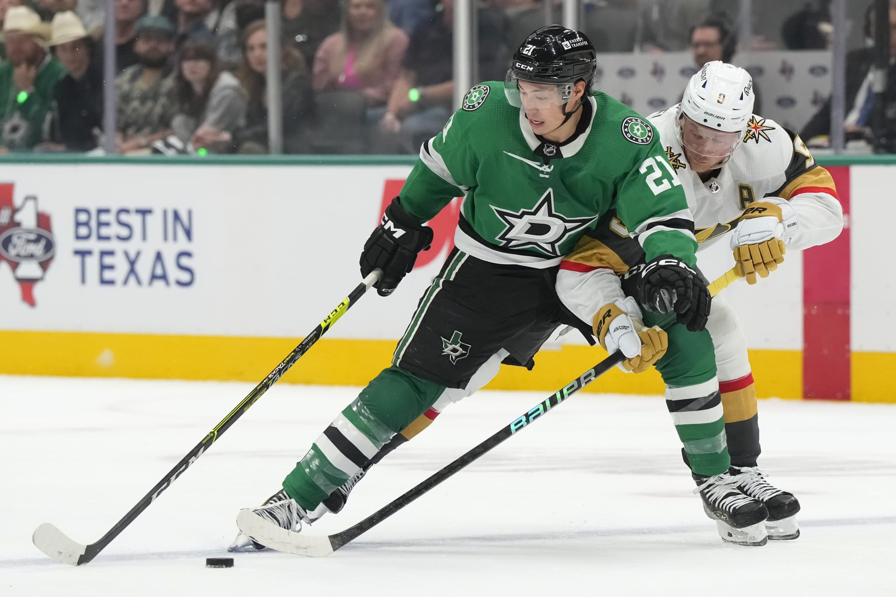 DALLAS, TEXAS - APRIL 22: Jason Robertson #21 of the Dallas Stars and Jack Eichel #9 of the Vegas Golden Knights compete for the puck during the first period in Game One of the First Round of the 2024 Stanley Cup Playoffs at the American Airlines Center on April 22, 2024 in Dallas, Texas.  (Photo by Sam Hodde/Getty Images)