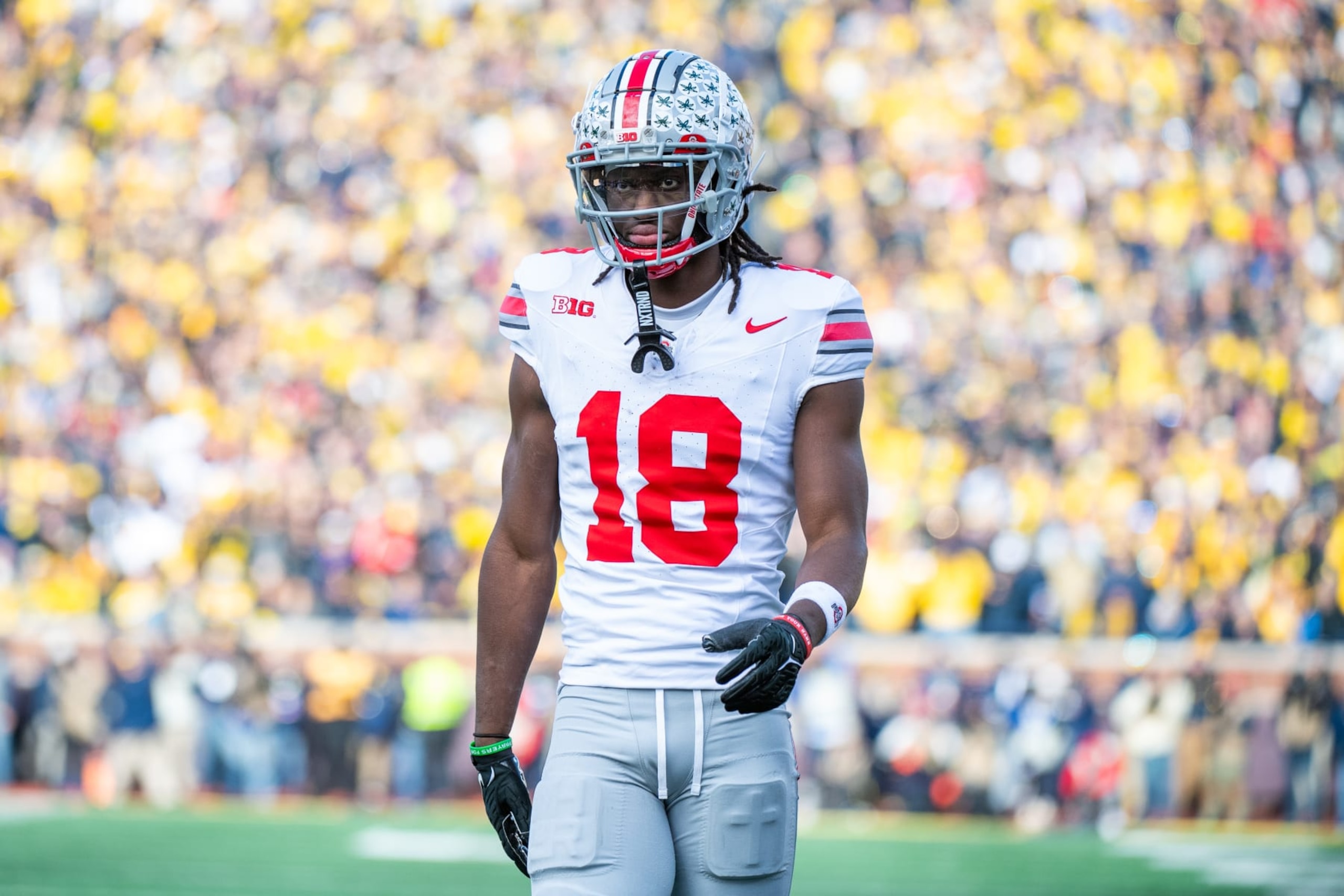 ANN ARBOR, MICHIGAN - NOVEMBER 25: Marvin Harrison Jr. #18 of the Ohio State Buckeyes walks up the field during the second half of a college football game against the Michigan Wolverines at Michigan Stadium on November 25, 2023 in Ann Arbor, Michigan. The Michigan Wolverines won the game 30-24 to win the Big Ten East. (Photo by Aaron J. Thornton/Getty Images)