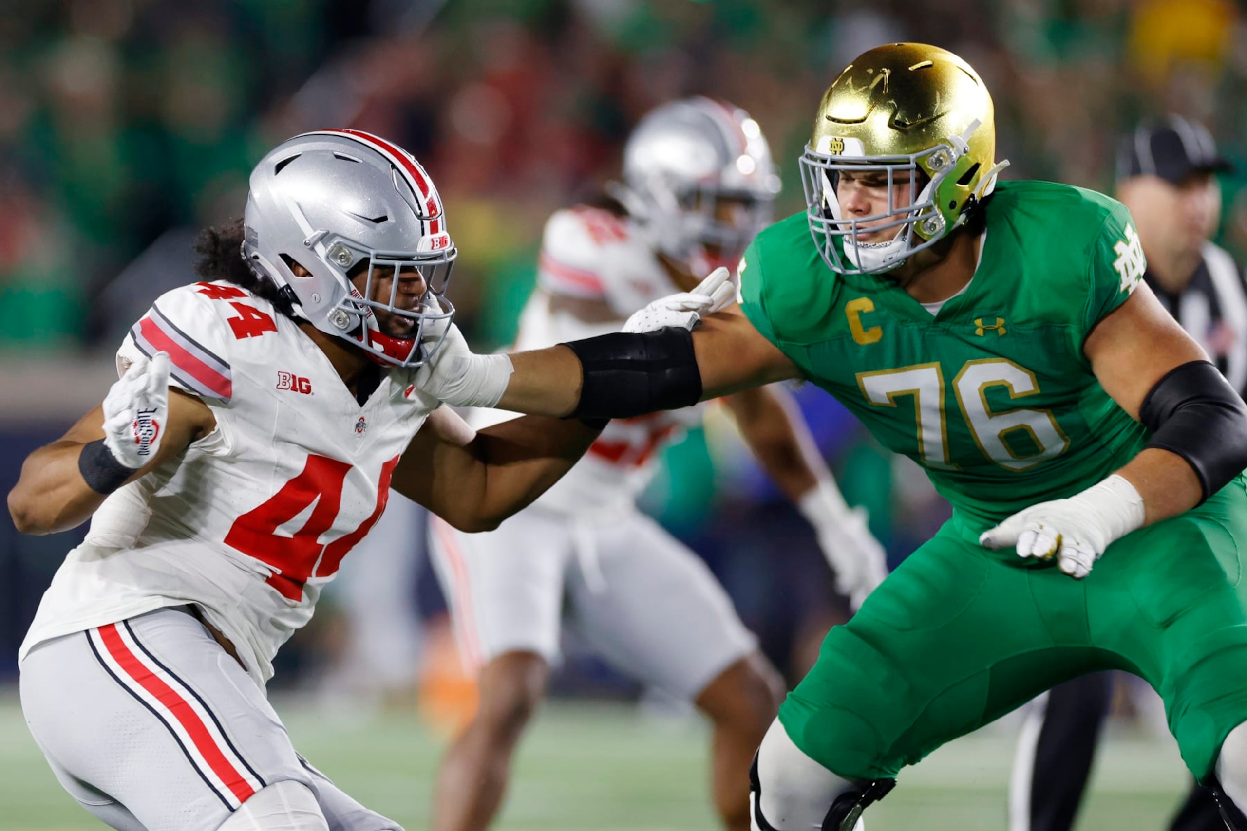 SOUTH BEND, IN - SEPTEMBER 23: Ohio State Buckeyes defensive end JT Tuimoloau (44) rushes against Notre Dame Fighting Irish offensive lineman Joe Alt (76) during a college football game on September 23, 2023 at Notre Dame Stadium in South Bend, Indiana. (Photo by Joe Robbins/Icon Sportswire via Getty Images) SOUTH BEND, IN - SEPTEMBER 23: Ohio State Buckeyes defensive end JT Tuimoloau (44) rushes against Notre Dame Fighting Irish offensive lineman Joe Alt (76) during a college football game on September 23, 2023 at Notre Dame Stadium in South Bend, Indiana. (Photo by Joe Robbins/Icon Sportswire via Getty Images)