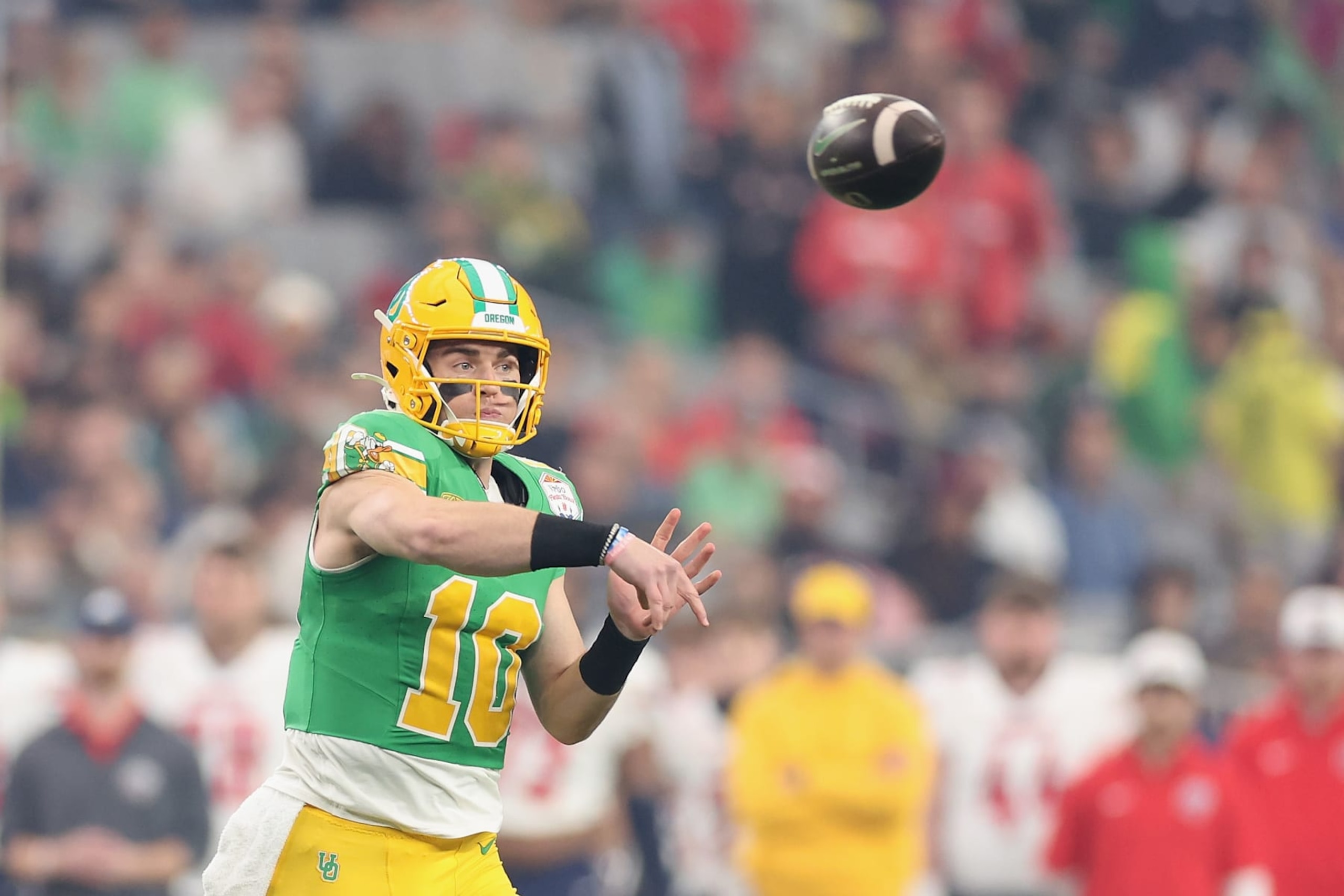 GLENDALE, ARIZONA - JANUARY 01: Quarterback Bo Nix #10 of the Oregon Ducks throws a pass during the first half of the Fiesta Bowl against the Liberty Flames at State Farm Stadium on January 01, 2024 in Glendale, Arizona. (Photo by Christian Petersen/Getty Images) GLENDALE, ARIZONA - JANUARY 01: Quarterback Bo Nix #10 of the Oregon Ducks throws a pass during the first half of the Fiesta Bowl against the Liberty Flames at State Farm Stadium on January 01, 2024 in Glendale, Arizona. (Photo by Christian Petersen/Getty Images)