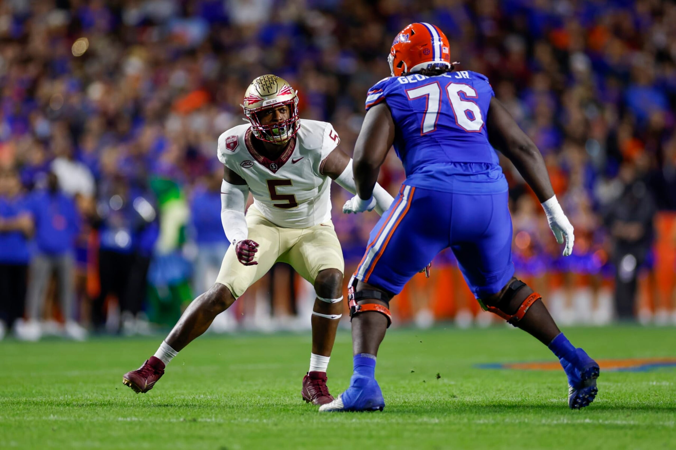 GAINESVILLE, FL - NOVEMBER 25: Florida State Seminoles defensive lineman Jared Verse (5) battles Florida Gators offensive lineman Damieon George Jr. (76) during the game between the Florida Gators and the Florida State Seminoles on November 25, 2023 at Ben Hill Griffin Stadium at Florida Field in Gainesville, Fl. (Photo by David Rosenblum/Icon Sportswire via Getty Images) GAINESVILLE, FL - NOVEMBER 25: Florida State Seminoles defensive lineman Jared Verse (5) battles Florida Gators offensive lineman Damieon George Jr. (76) during the game between the Florida Gators and the Florida State Seminoles on November 25, 2023 at Ben Hill Griffin Stadium at Florida Field in Gainesville, Fl. (Photo by David Rosenblum/Icon Sportswire via Getty Images)