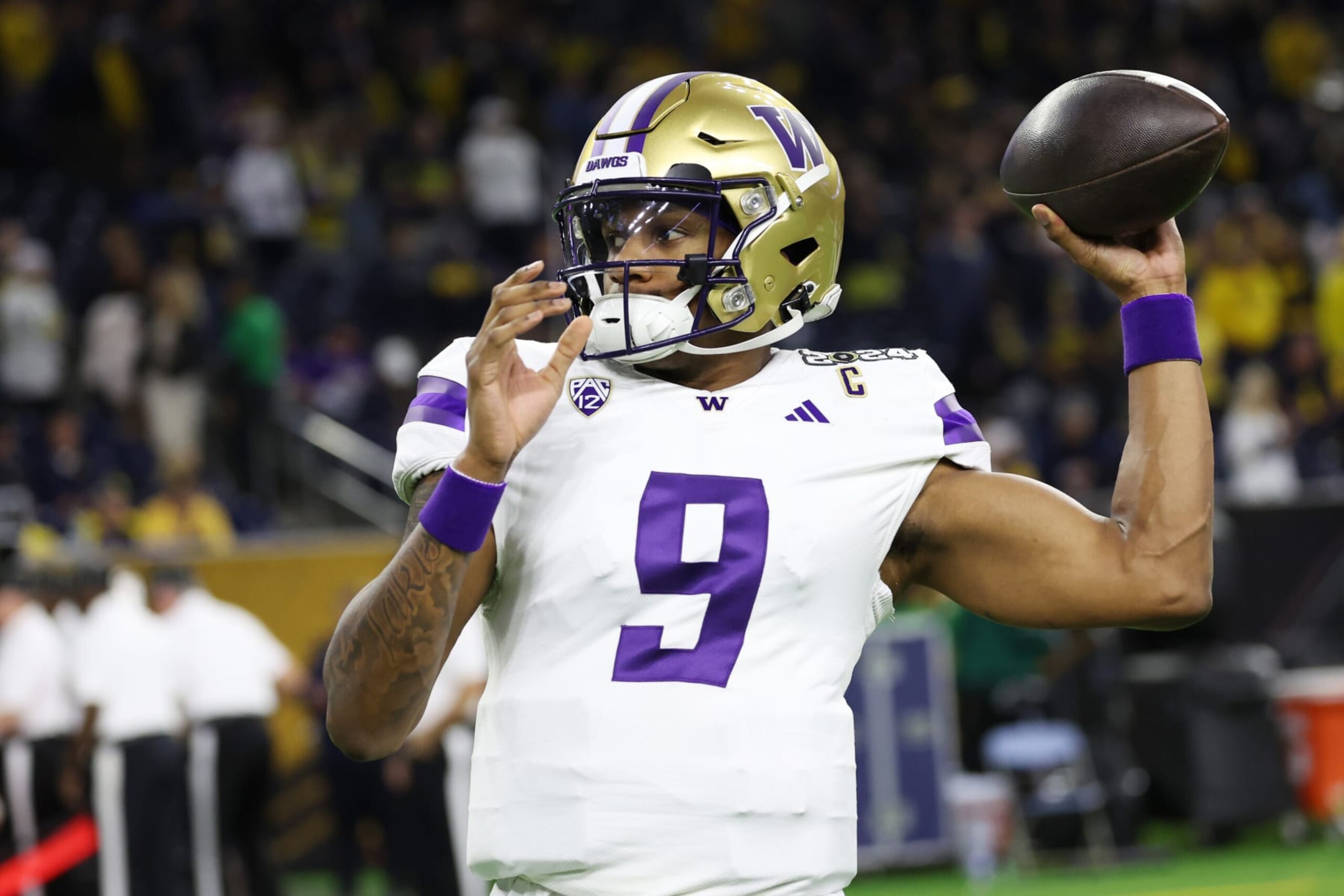 HOUSTON, TEXAS - JANUARY 8: Michael Penix Jr. #9 of the Washington Huskies warms up prior to the CFP National Championship game at NRG Stadium on January 8, 2024 in Houston, Texas. (Photo by CFP/Getty Images)