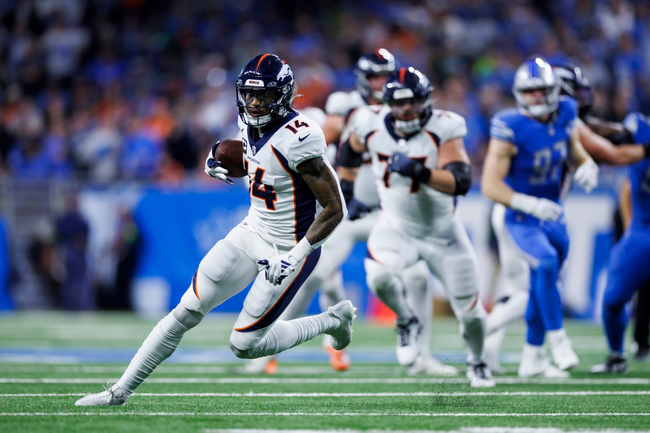 DETROIT, MICHIGAN - DECEMBER 16: Courtland Sutton #14 of the Denver Broncos runs the ball after a catch during an NFL football game against the Detroit Lions at Ford Field on December 16, 2023 in Detroit, Michigan. (Photo by Ryan Kang/Getty Images) DETROIT, MICHIGAN - DECEMBER 16: Courtland Sutton #14 of the Denver Broncos runs the ball after a catch during an NFL football game against the Detroit Lions at Ford Field on December 16, 2023 in Detroit, Michigan. (Photo by Ryan Kang/Getty Images)