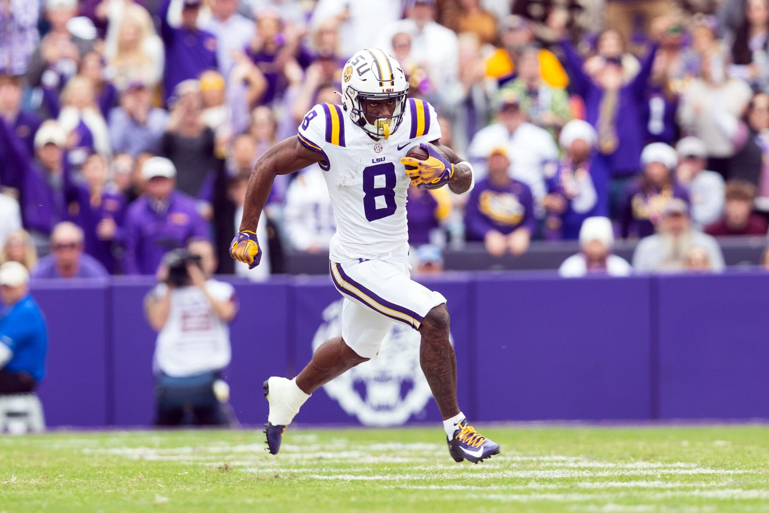 BATON ROUGE, LA - NOVEMBER 25: LSU Tigers wide receiver Malik Nabers (8) catches a pass during a game between the Texas A&M Aggies and the LSU Tigers in Tiger Stadium in Baton Rouge, Louisiana on November 25, 2023.(Photo by John Korduner/Icon Sportswire via Getty Images)