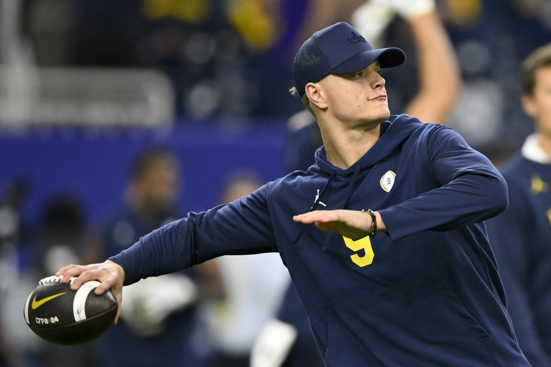 HOUSTON, TEXAS - JANUARY 08: J.J. McCarthy #9 of the Michigan Wolverines warms up before the 2024 CFP National Championship game against the Washington Huskies at NRG Stadium on January 08, 2024 in Houston, Texas. (Photo by Alika Jenner/Getty Images)
