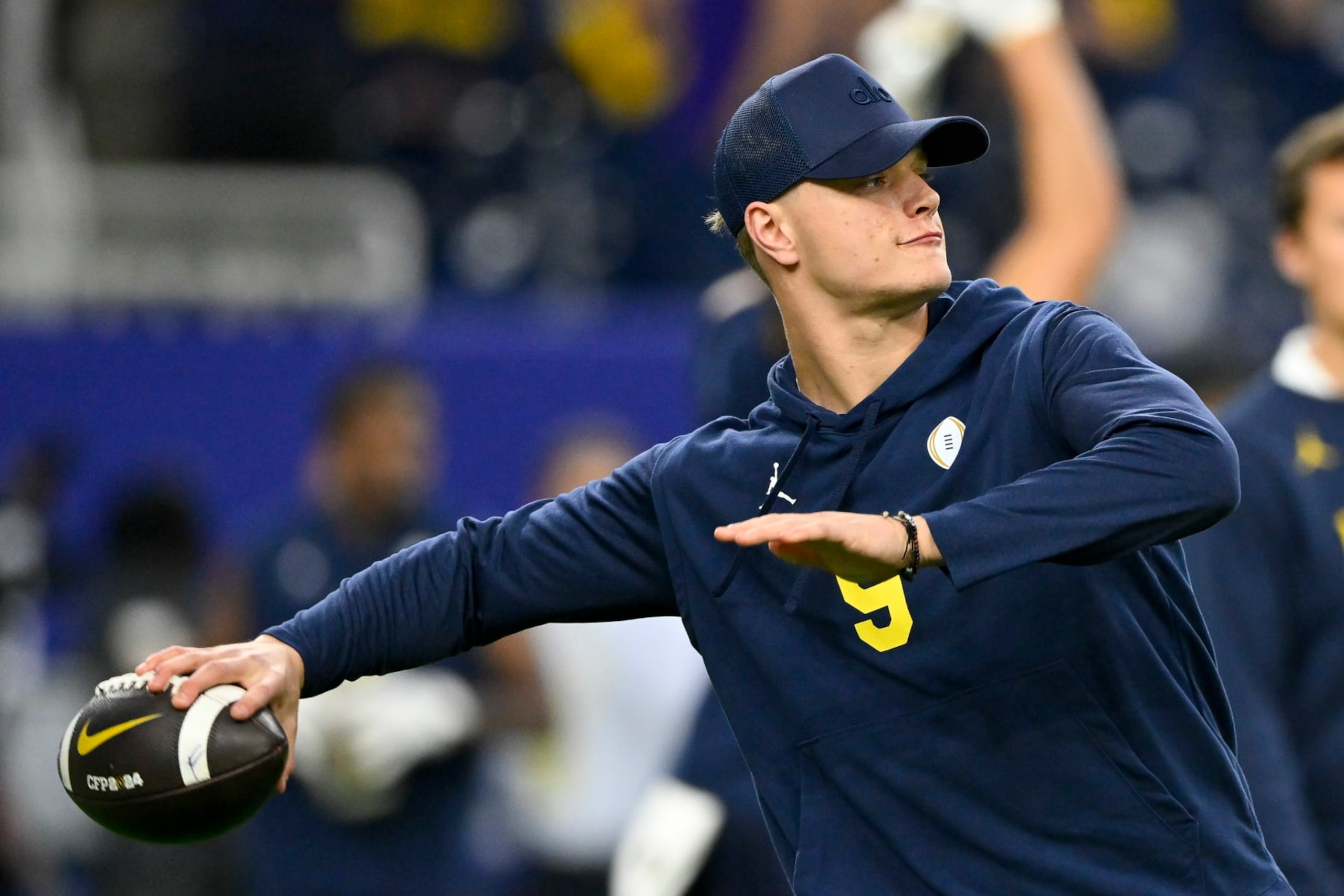 HOUSTON, TEXAS - JANUARY 08: J.J. McCarthy #9 of the Michigan Wolverines warms up before the 2024 CFP National Championship game against the Washington Huskies at NRG Stadium on January 08, 2024 in Houston, Texas. (Photo by Alika Jenner/Getty Images)