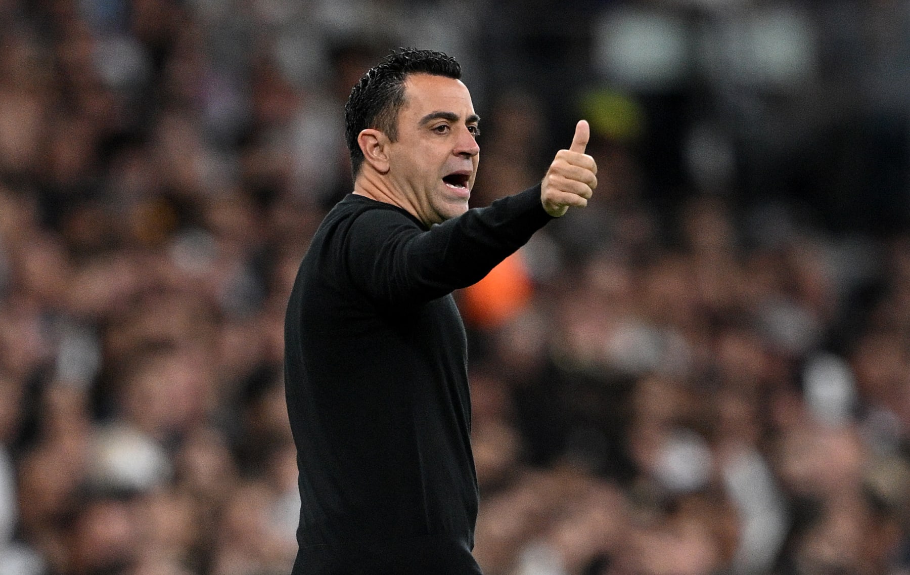 MADRID, SPAIN - APRIL 21: Xavi, Head Coach of FC Barcelona, gestures a thumbs-up during the LaLiga EA Sports match between Real Madrid CF and FC Barcelona at Estadio Santiago Bernabeu on April 21, 2024 in Madrid, Spain. (Photo by David Ramos/Getty Images) (Photo by David Ramos/Getty Images)