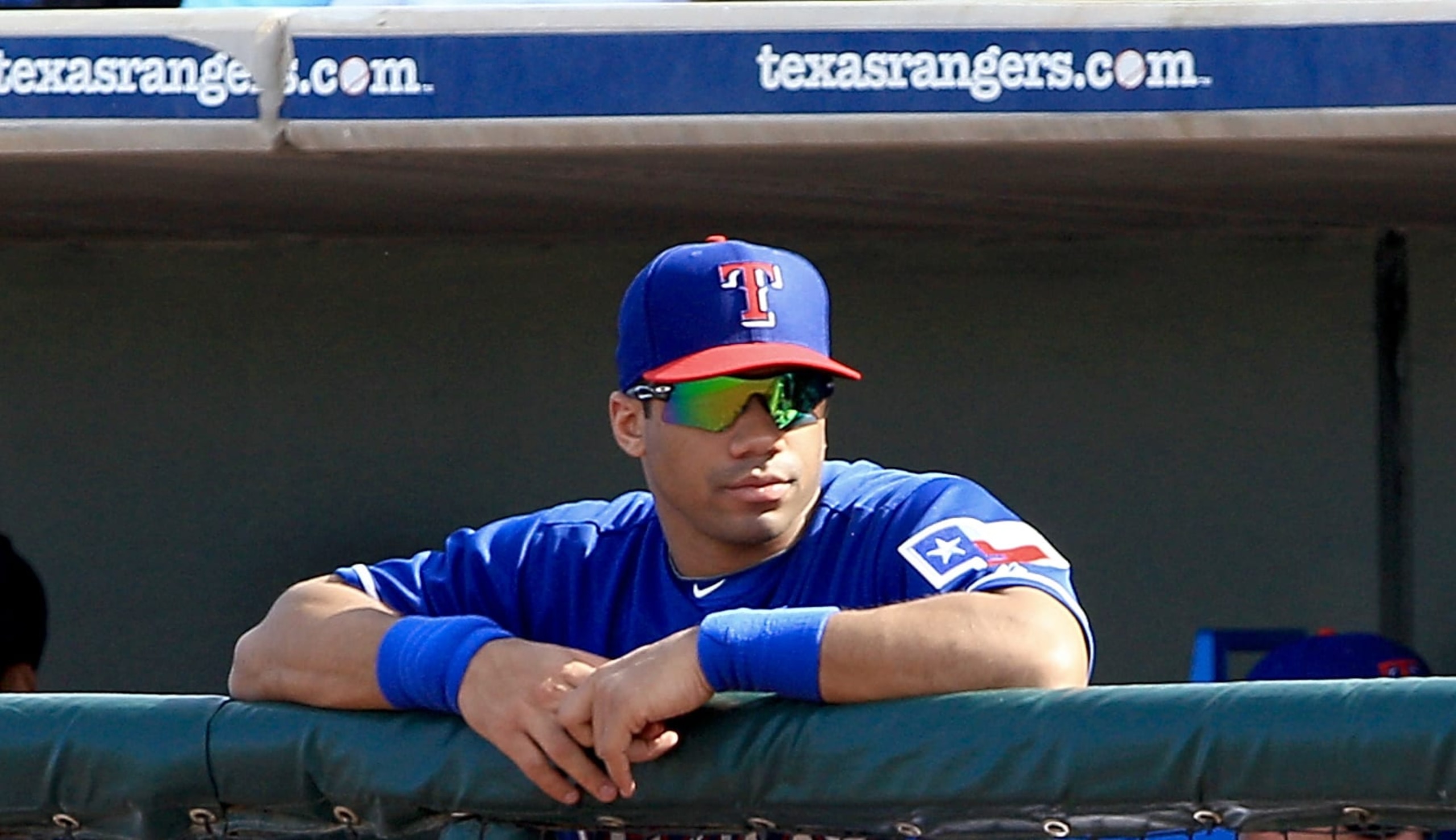 SURPRISE, AZ - MARCH 03:  Russell Wilson #3 of the Texas Rangers watches actionon the field during a spring training baseball game against the Cleveland Indians on March 3, 2014 in Surprise, Arizona.  (Photo by Gregg Forwerck/Getty Images)