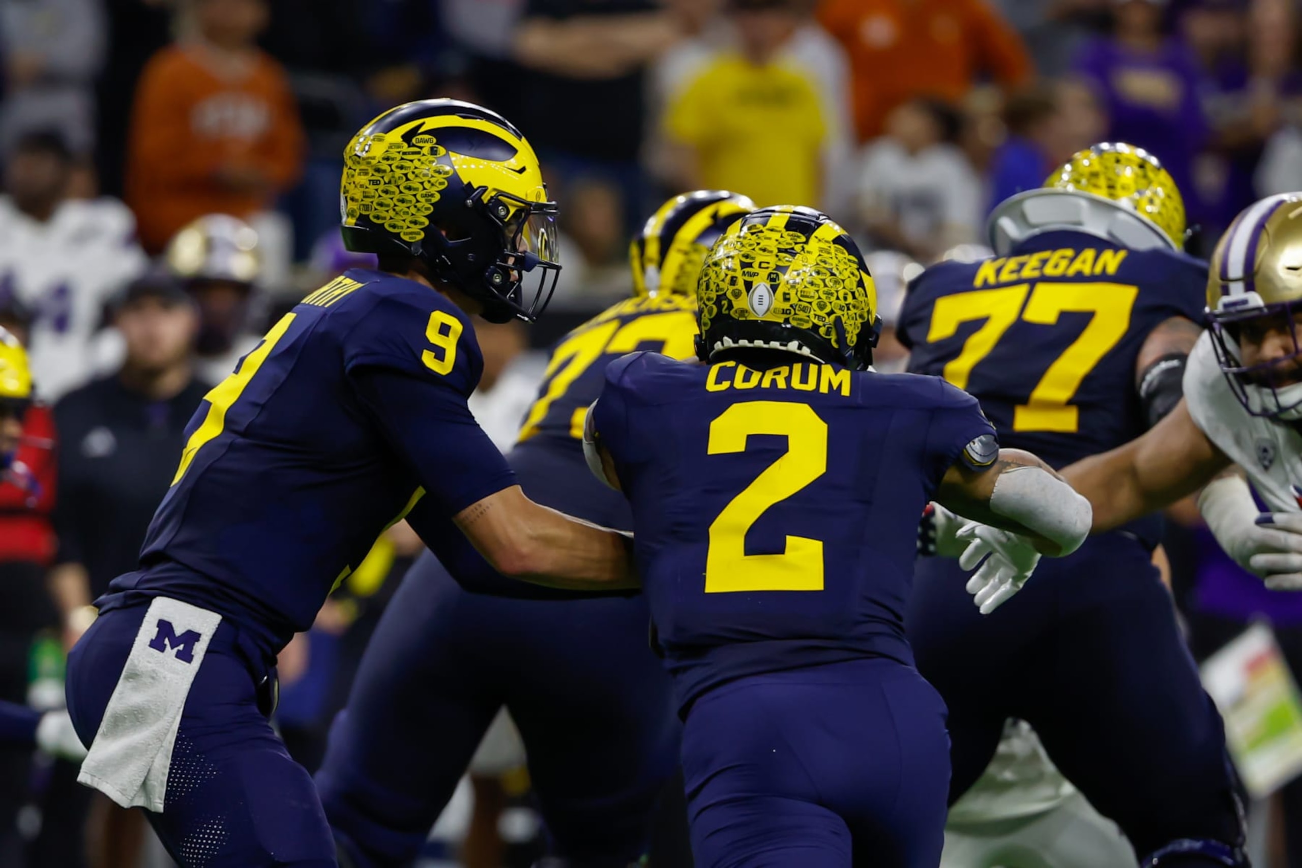 HOUSTON, TX - JANUARY 08: Michigan Wolverines quarterback J.J. McCarthy (9) has a play action pass play with Michigan Wolverines running back Blake Corum (2) during the CFP National Championship game Michigan Wolverines and Washington Huskies on January 8, 2024, at NRG Stadium in Houston, Texas. (Photo by David Buono/Icon Sportswire via Getty Images) HOUSTON, TX - JANUARY 08: Michigan Wolverines quarterback J.J. McCarthy (9) has a play action pass play with Michigan Wolverines running back Blake Corum (2) during the CFP National Championship game Michigan Wolverines and Washington Huskies on January 8, 2024, at NRG Stadium in Houston, Texas. (Photo by David Buono/Icon Sportswire via Getty Images)
