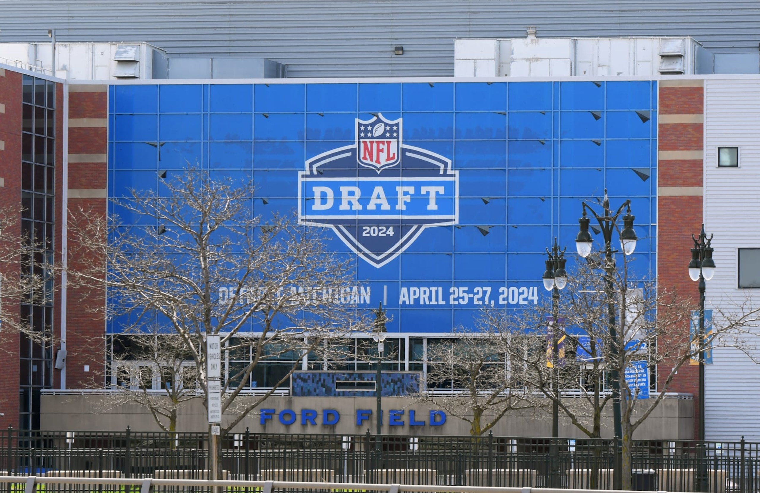 DETROIT, MI - APRIL 18: A general exterior view of Ford Field, home of the NFL Detroit Lions, with a sign displayed to announce the upcoming NFL draft. The draft is scheduled to be held around Campus Martius Park and Hart Plaza in Detroit, Michigan on April 25Â27, 2024. Photo taken prior to the MLB game between the Detroit Tigers and the Texas Rangers at Comerica Park on April 18, 2024 in Detroit, Michigan. (Photo by Mark Cunningham/MLB Photos via Getty Images) DETROIT, MI - APRIL 18: A general exterior view of Ford Field, home of the NFL Detroit Lions, with a sign displayed to announce the upcoming NFL draft. The draft is scheduled to be held around Campus Martius Park and Hart Plaza in Detroit, Michigan on April 25Â27, 2024. Photo taken prior to the MLB game between the Detroit Tigers and the Texas Rangers at Comerica Park on April 18, 2024 in Detroit, Michigan. (Photo by Mark Cunningham/MLB Photos via Getty Images)