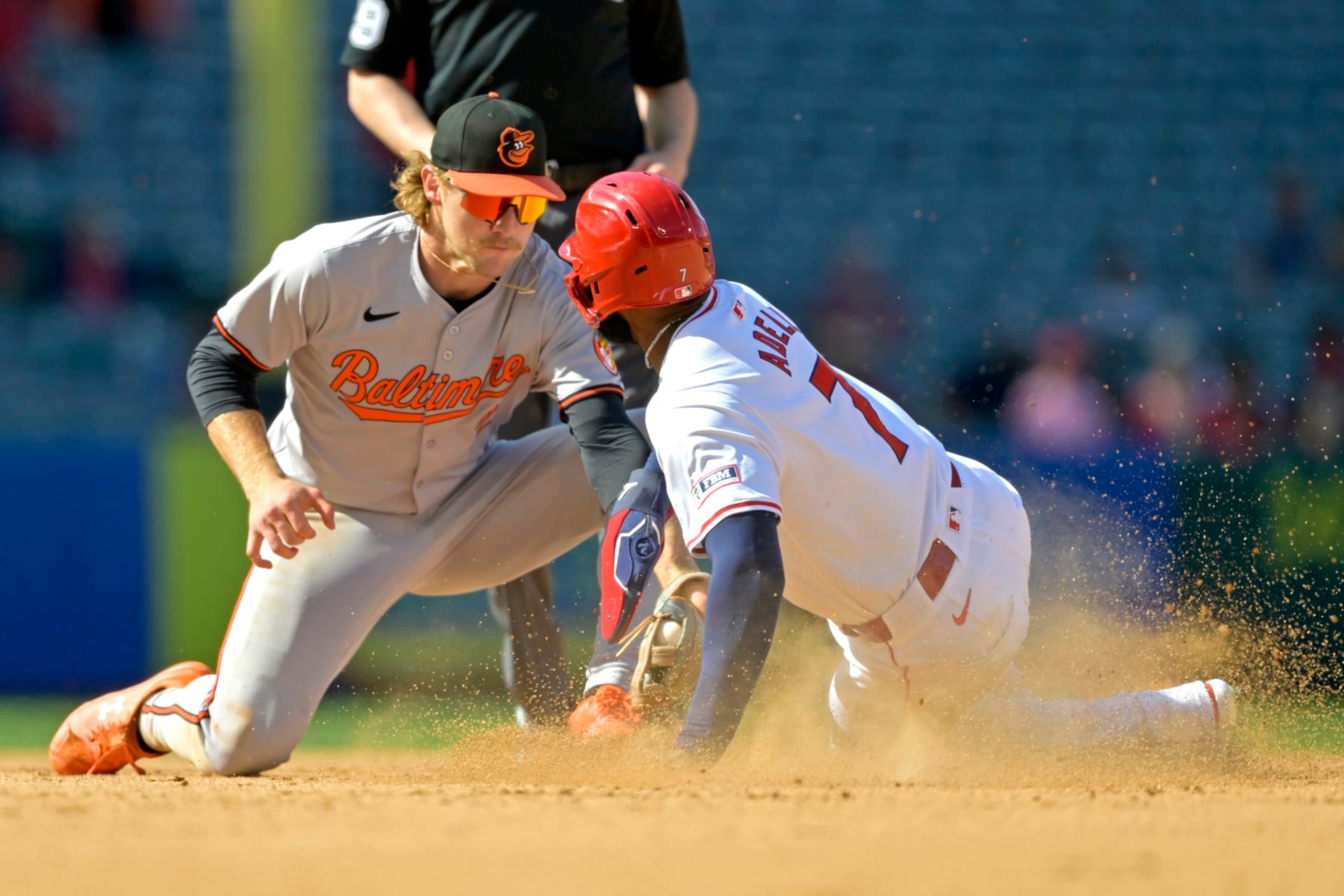 ANAHEIM, CALIFORNIA - APRIL 24: After a review of the play Jo Adell #7 of the Los Angeles Angels is caught stealing on a tag by Gunnar Henderson #2 of the Baltimore Orioles in the ninth inning at Angel Stadium of Anaheim on April 24, 2024 in Anaheim, California. (Photo by Jayne Kamin-Oncea/Getty Images)