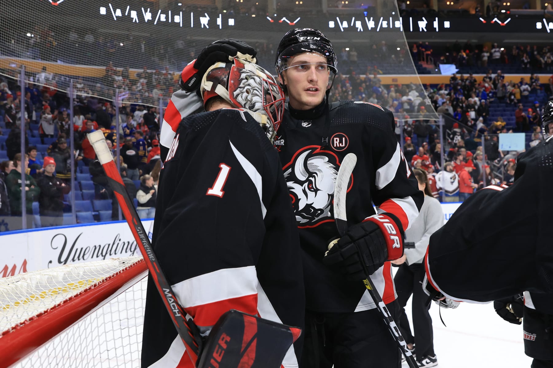 BUFFALO, NEW YORK - APRIL 2: Ukko-Pekka Luukkonen #1 of the Buffalo Sabres is congratulated by Tage Thompson #72 following their 6-2 victory against the Washington Capitals during an NHL game on April 2, 2024 at KeyBank Center in Buffalo, New York. (Photo by Bill Wippert/NHLI via Getty Images)