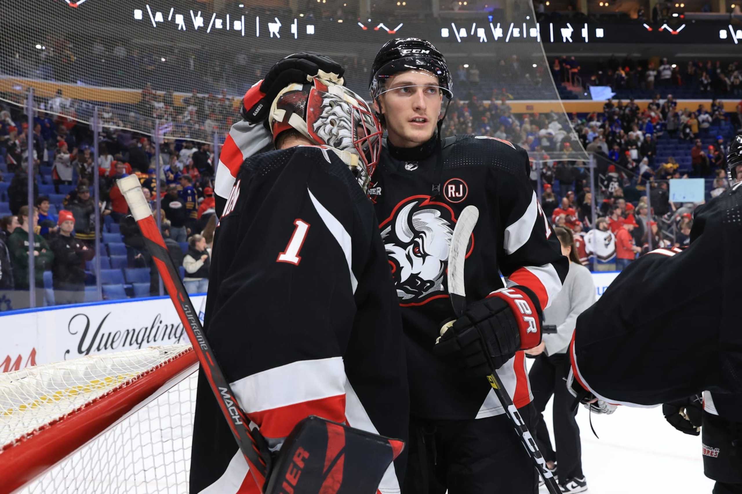 BUFFALO, NEW YORK - APRIL 2: Ukko-Pekka Luukkonen #1 of the Buffalo Sabres is congratulated by Tage Thompson #72 following their 6-2 victory against the Washington Capitals during an NHL game on April 2, 2024 at KeyBank Center in Buffalo, New York. (Photo by Bill Wippert/NHLI via Getty Images)