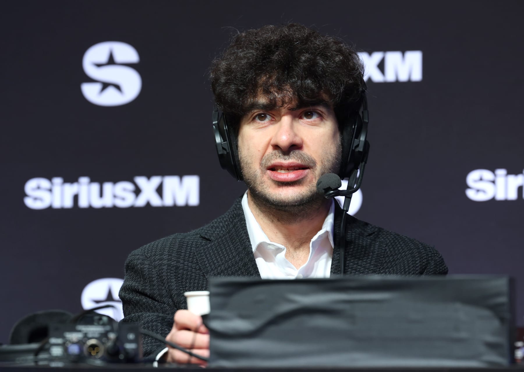LAS VEGAS, NEVADA - FEBRUARY 08: Tony Khan speaks on SiriusXM at Super Bowl LVIII on February 08, 2024 in Las Vegas, Nevada. (Photo by Cindy Ord/Getty Images for SiriusXM)