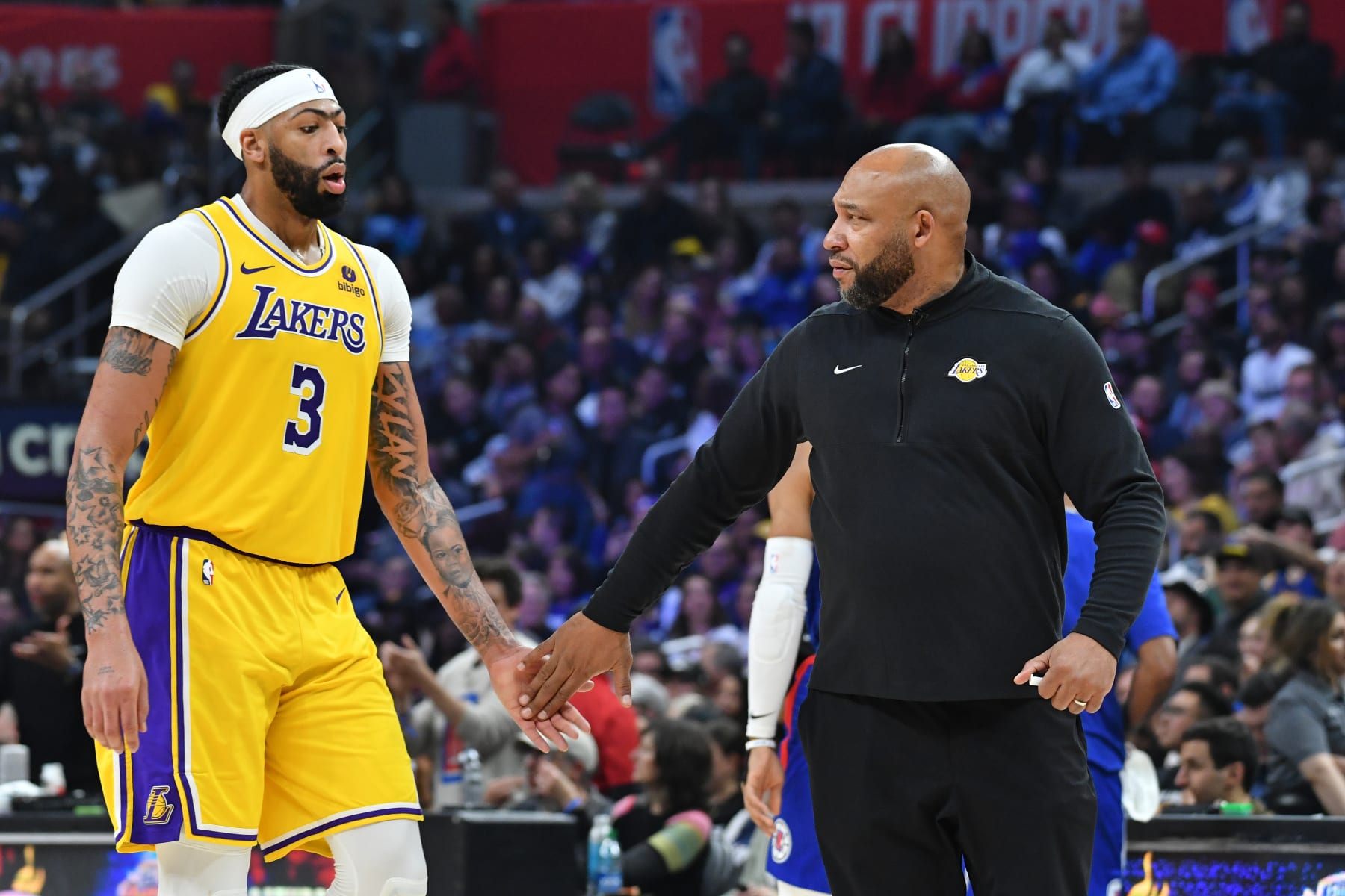 LOS ANGELES, CA - JANUARY 23: Anthony Davis #3 of the Los Angeles Lakers high fives Head Coach Darvin Ham of the Los Angeles Lakers during the game against the LA Clippers on January 23, 2024 at Crypto.Com Arena in Los Angeles, California. NOTE TO USER: User expressly acknowledges and agrees that, by downloading and/or using this Photograph, user is consenting to the terms and conditions of the Getty Images License Agreement. Mandatory Copyright Notice: Copyright 2024 NBAE (Photo by Juan Ocampo/NBAE via Getty Images)